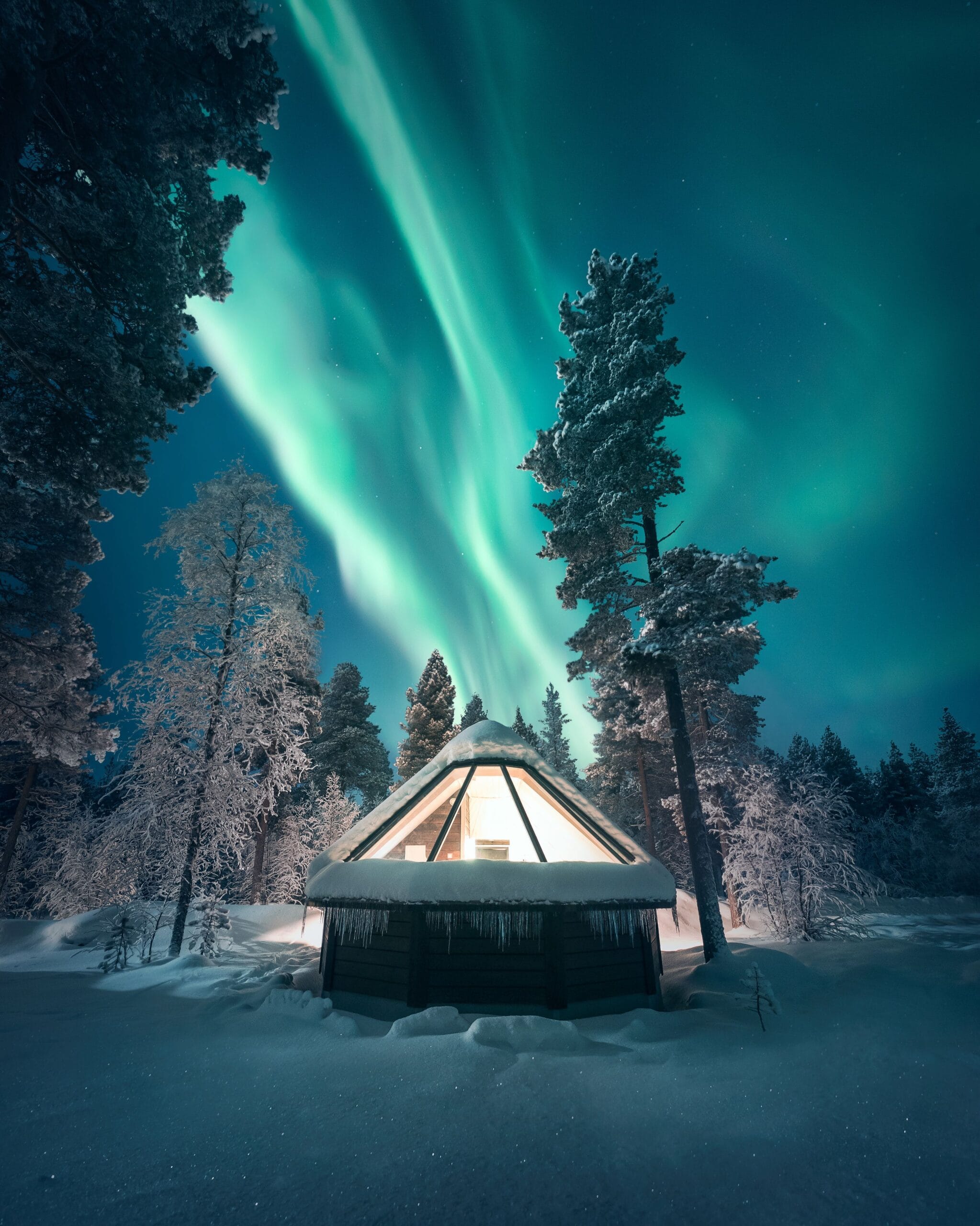 Glass-roof Aurora Cabin under the Northern Lights at Aurora Village Ivalo in far-north Finnish Lapland