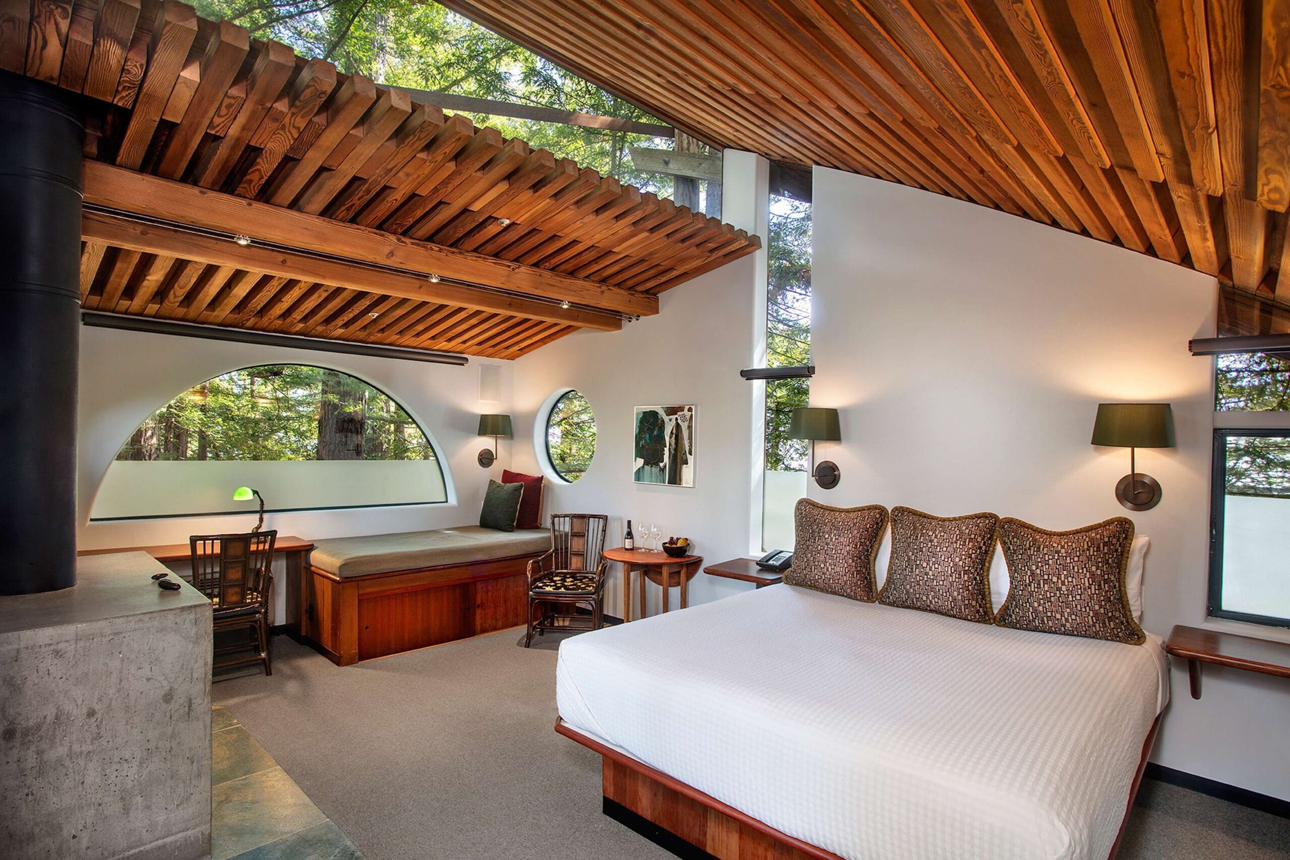 Triangular Tree House room interior with skylight over the bed at Post Ranch Inn, Big Sur luxury treehouse hotel
