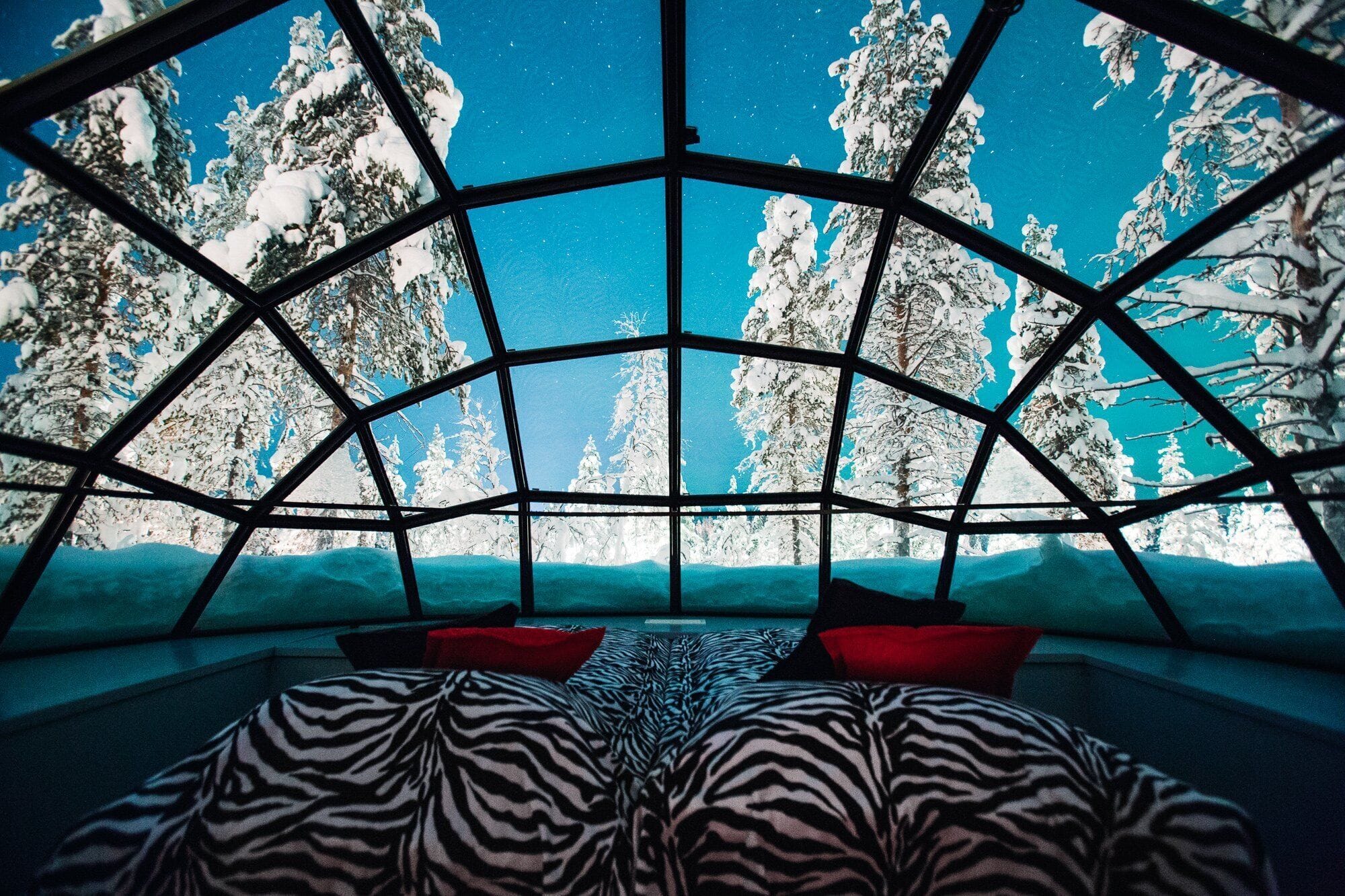 Kelo-Glass Igloo combining a log chalet with a glass-roof bedroom at Kakslauttanen Arctic Resort, Finland