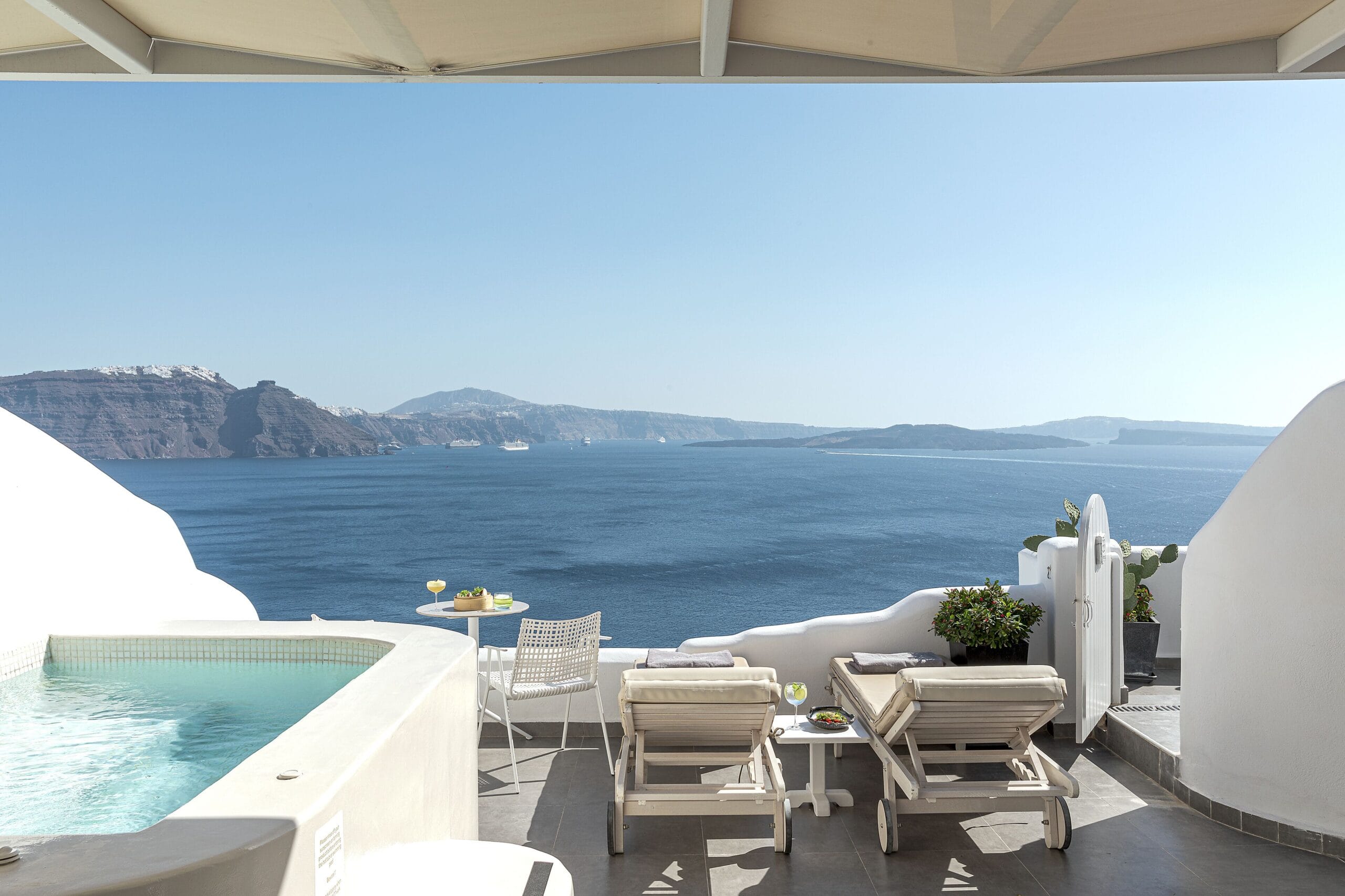 Cave suite terrace with private pool and caldera views at Santorini Secret Suites & Spa, a boutique cave hotel in Oia