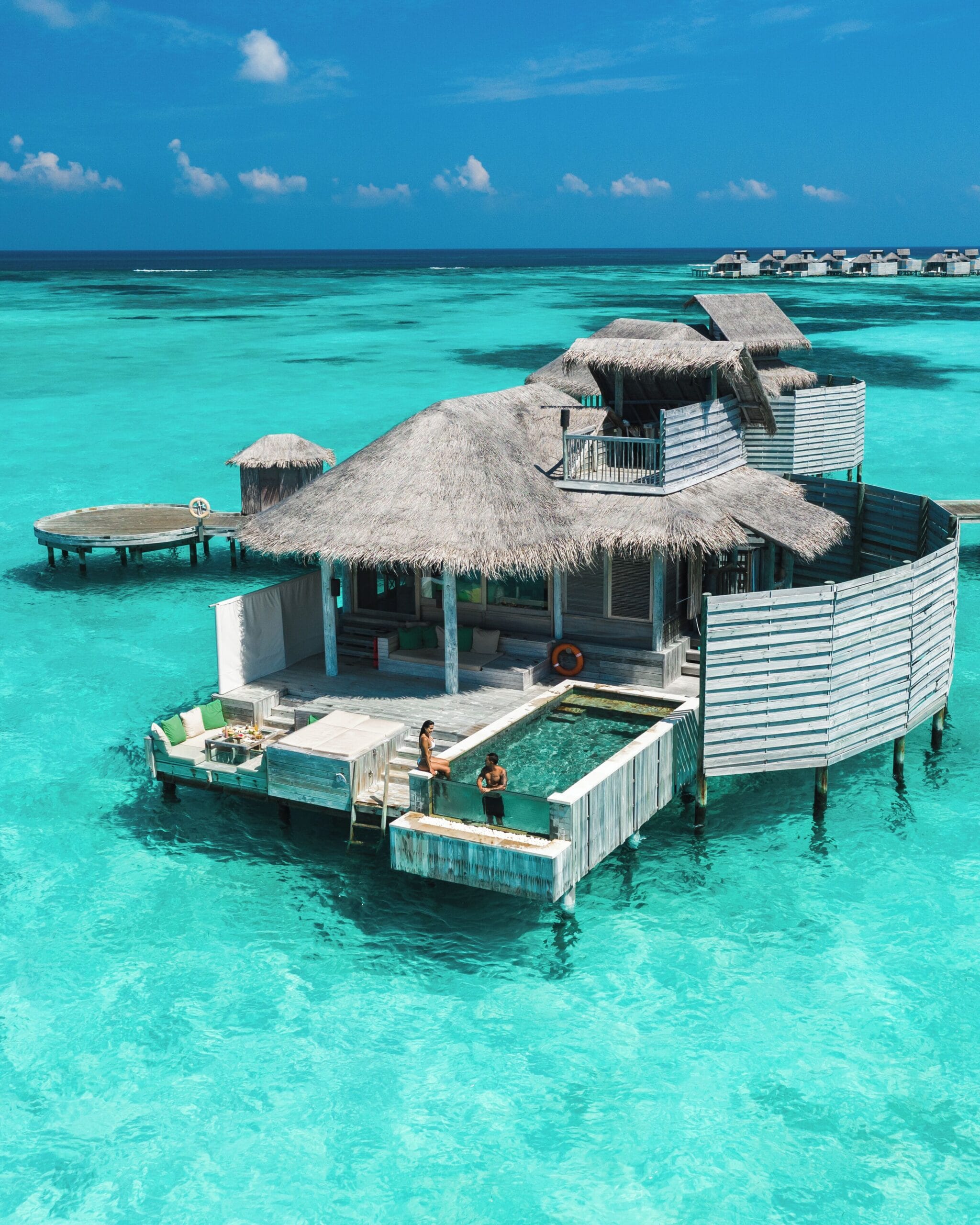 Barefoot overwater villa with rooftop deck at Six Senses Laamu, an eco-luxury Maldives overwater bungalow