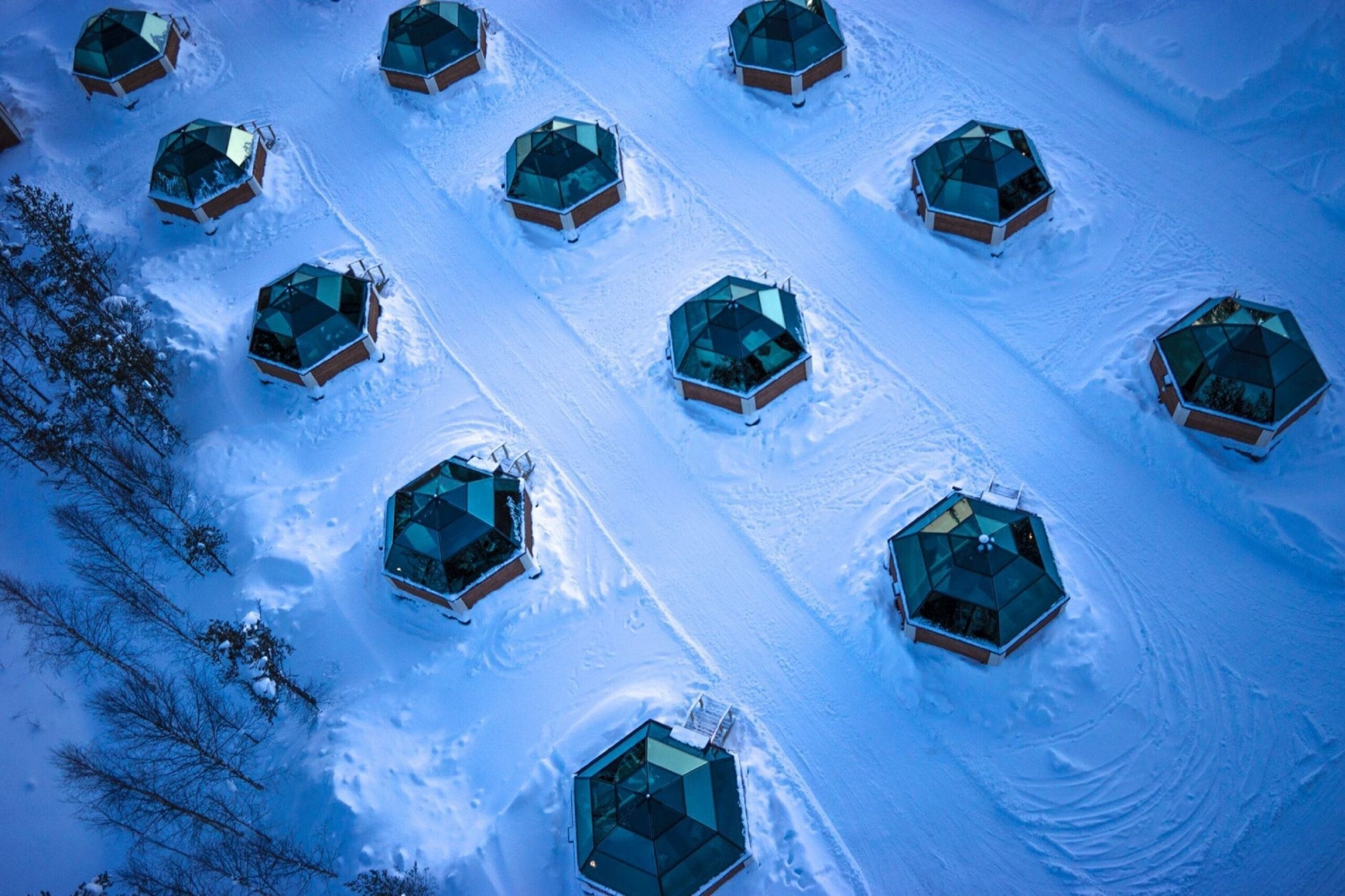 Heated glass igloo with 360-degree roof under the Northern Lights at Arctic SnowHotel & Glass Igloos in Rovaniemi, Finland