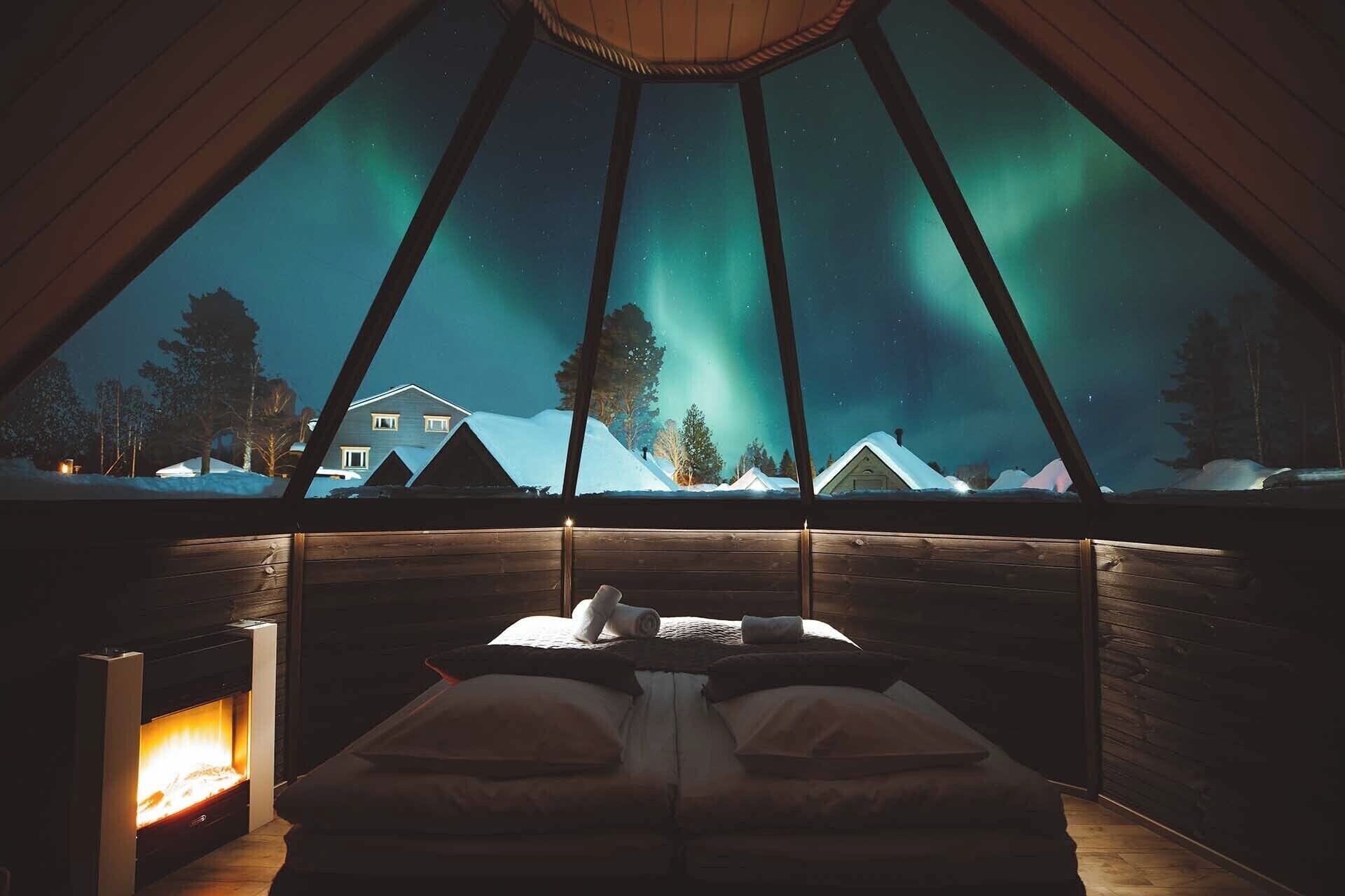 Glass-roof Aurora Cabin under the Northern Lights at Apukka Resort, the best glass igloo hotel near Rovaniemi, Finland