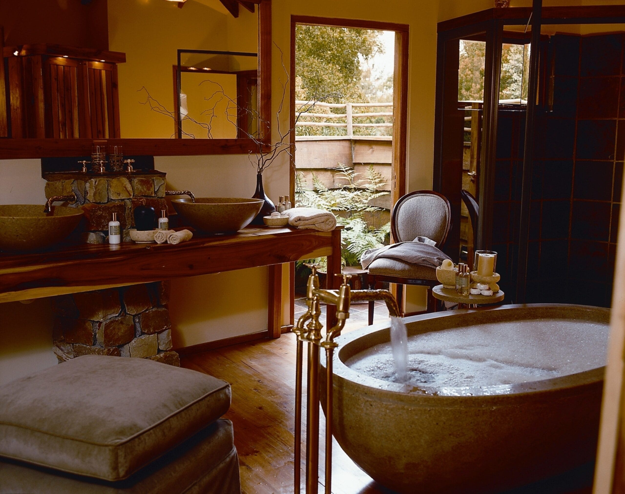 Treetop suite interior with fireplace and African-inspired decor at Tsala Treetop Lodge, Plettenberg Bay South Africa