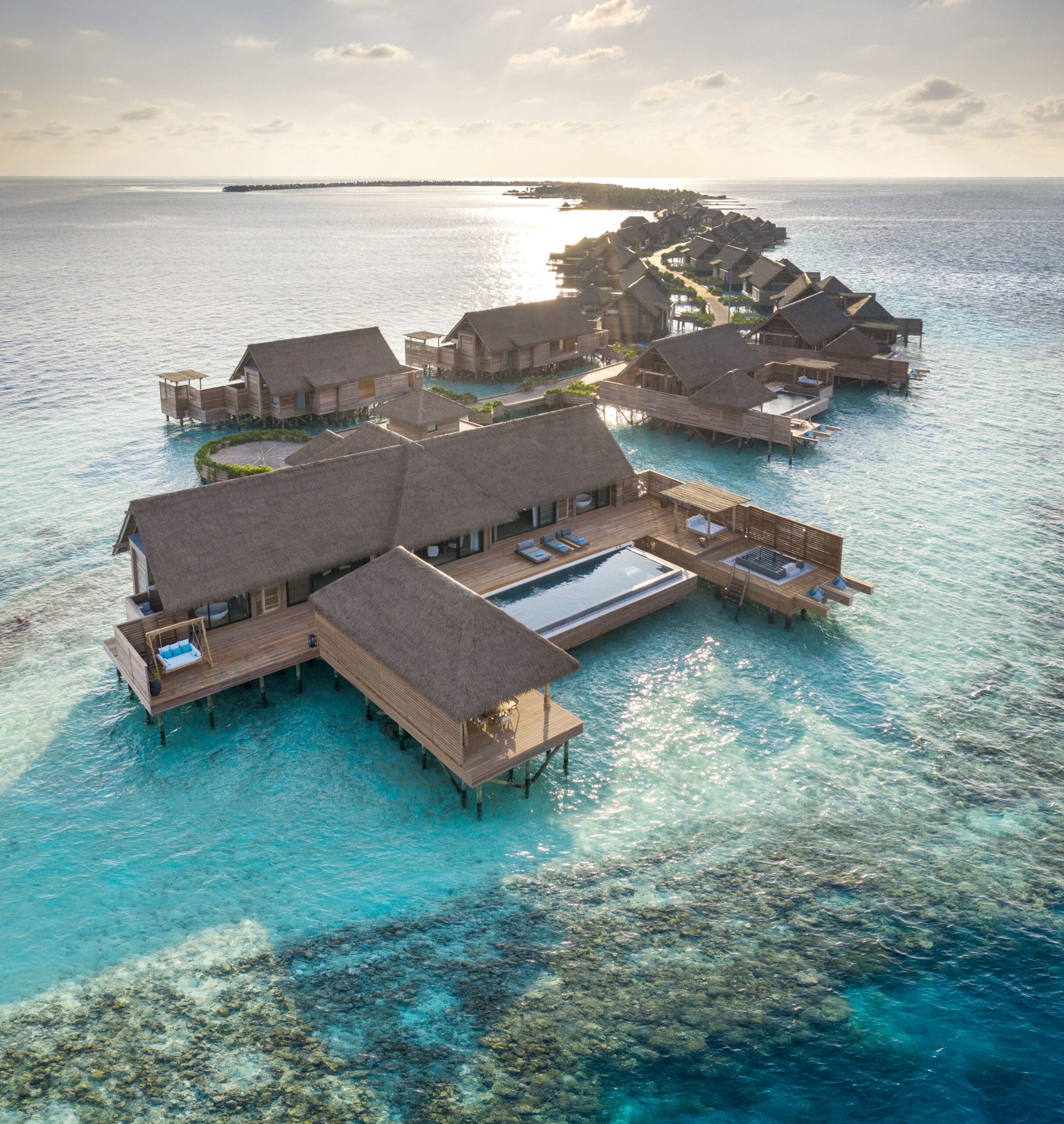 Oversized overwater pool villa at Waldorf Astoria Maldives Ithaafushi, a complete-luxury Maldives overwater bungalow