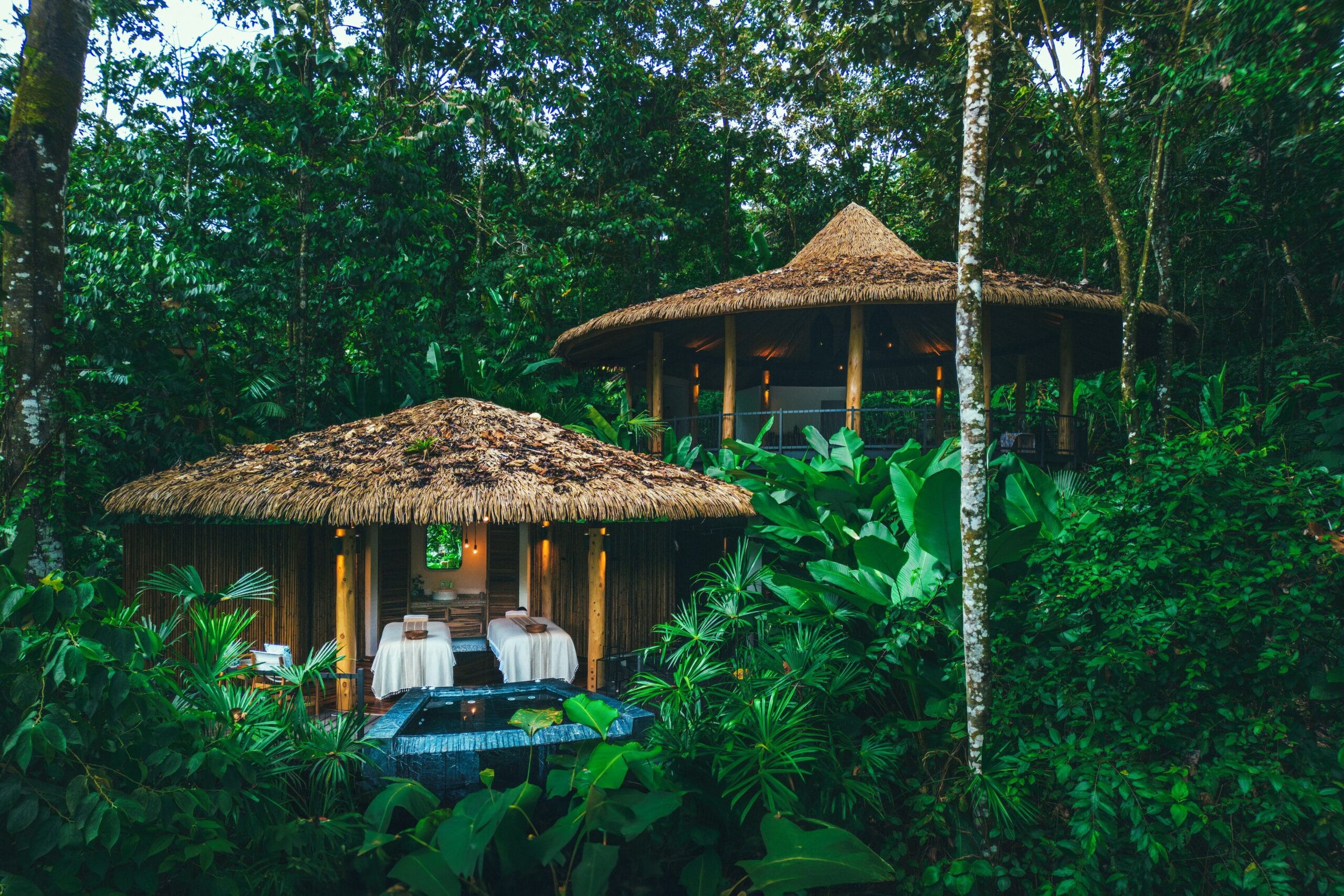 Private hot-spring plunge pool on a tented deck overlooking Arenal Volcano at Nayara Tented Camp, Costa Rica