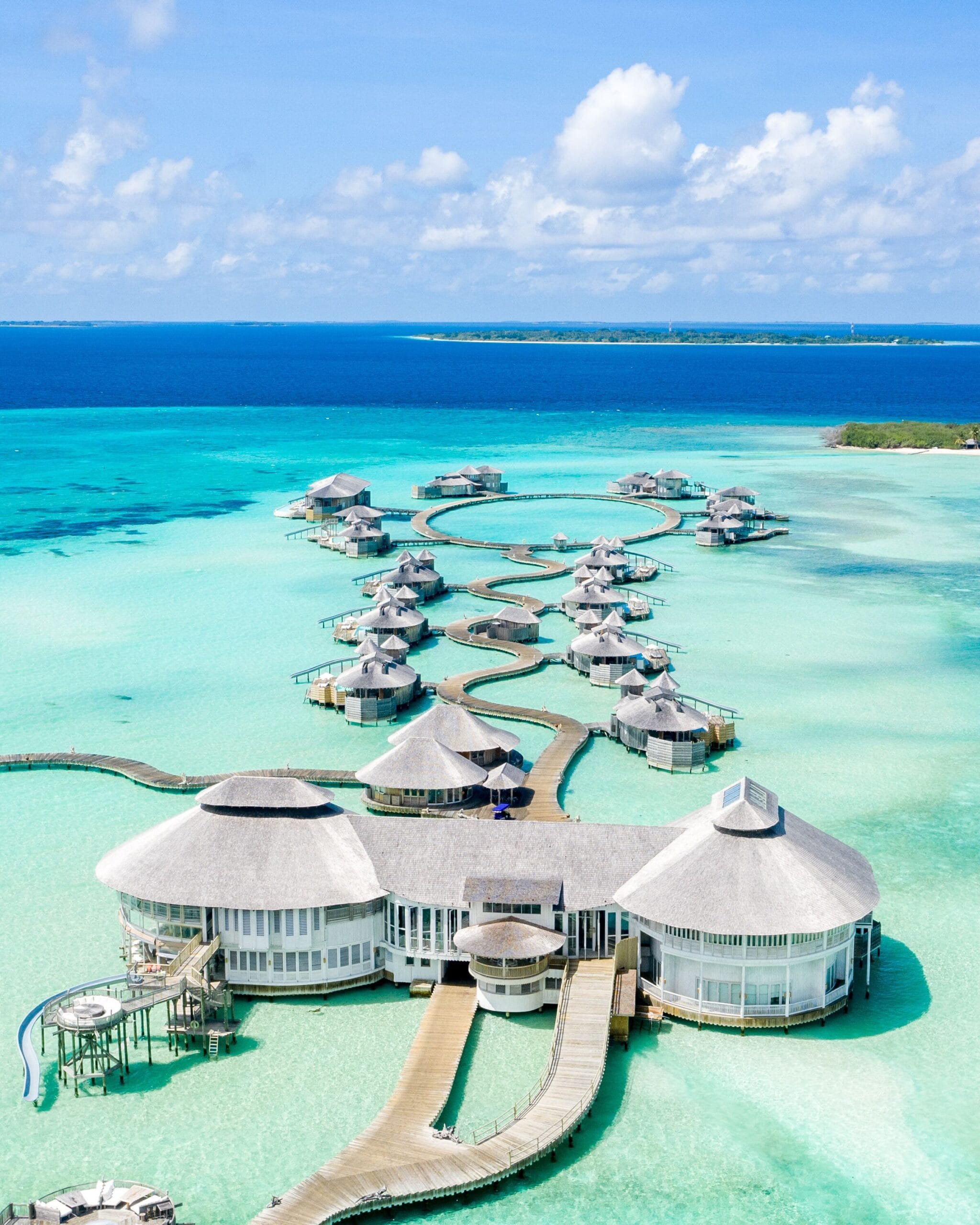 Soneva Jani overwater villas across a vast private lagoon, the most iconic Maldives water villa resort