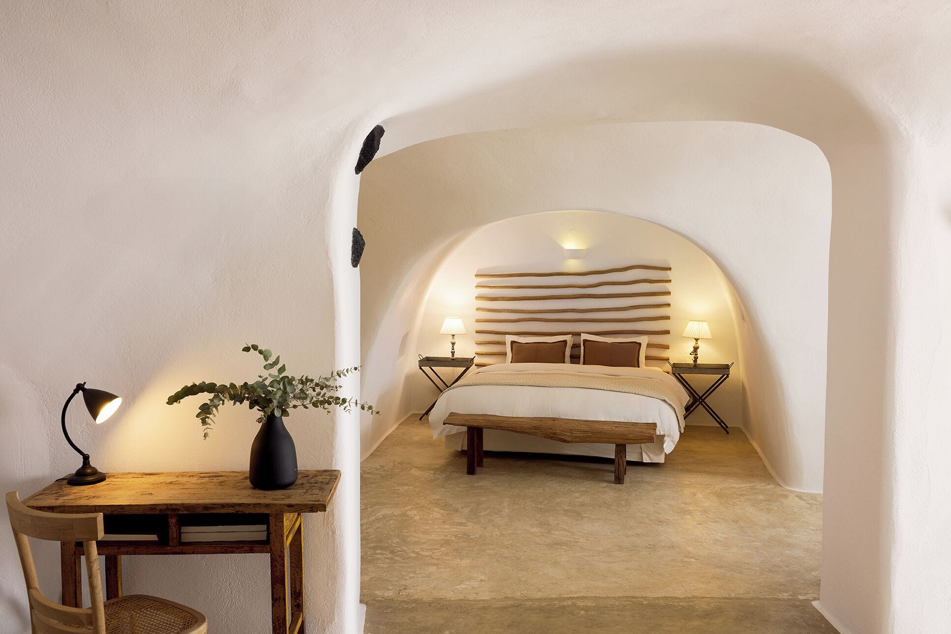 Iconic Santorini cave suite interior in Imerovigli with traditional Cycladic design and caldera view