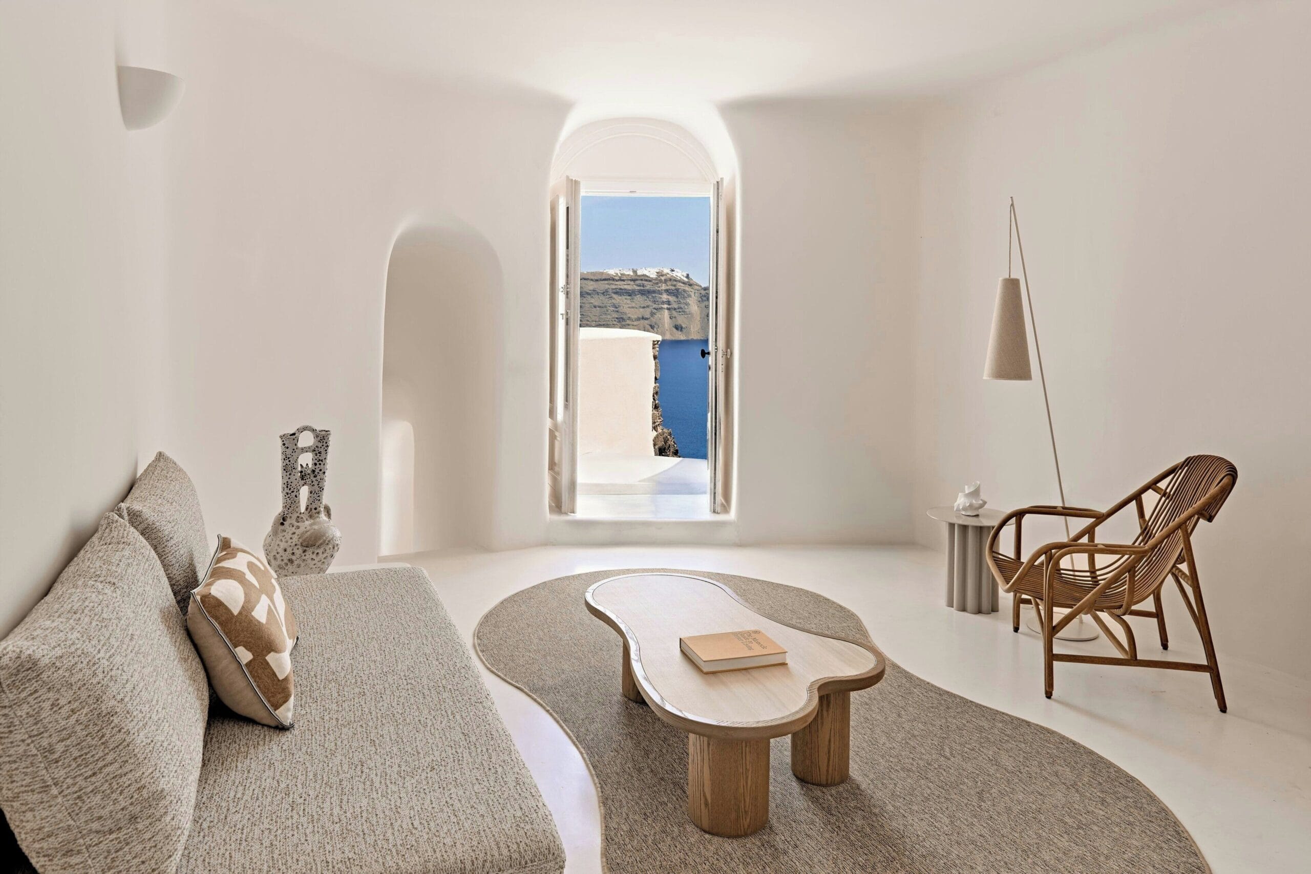 Private terrace and infinity pool overlooking the caldera at Mystique Luxury Collection Hotel, Oia Santorini
