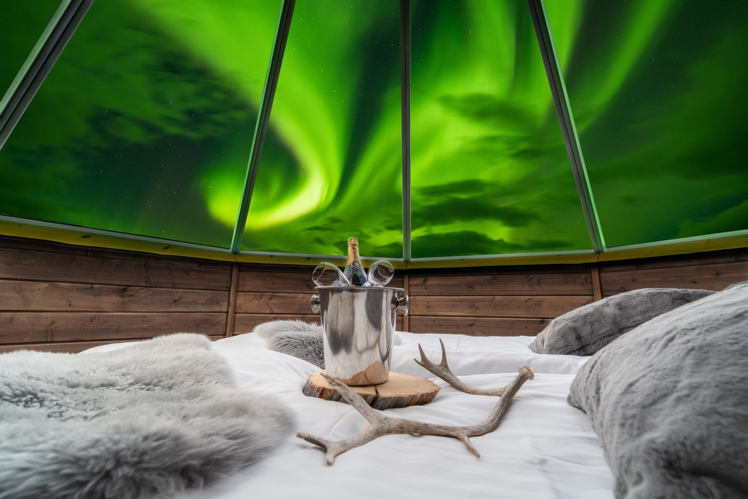 Luxury glass igloo hotel under the Northern Lights