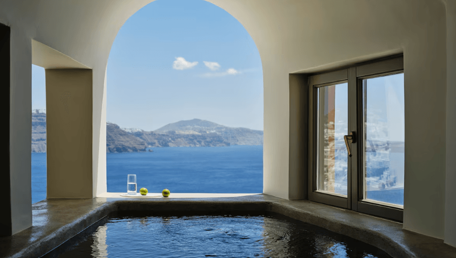 Cave suite with private infinity pool and unobstructed caldera views at Andronis Luxury Suites, the best cave hotel in Santorini