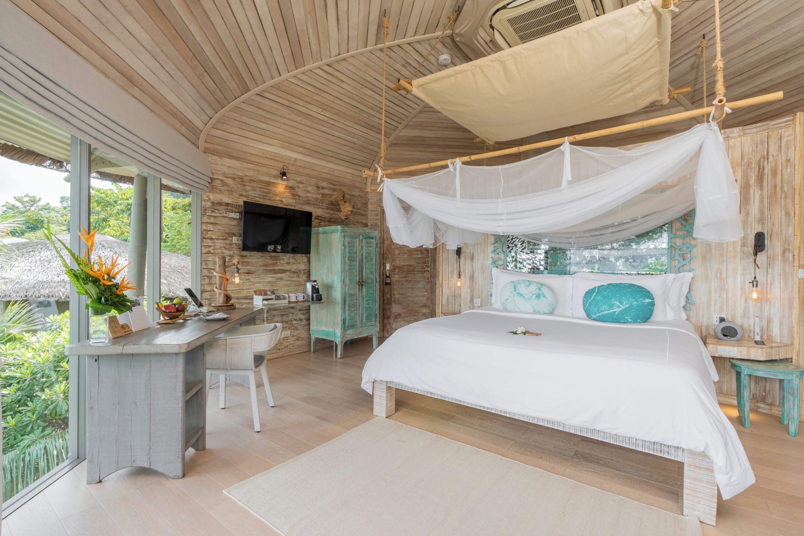 Treehouse villa with Phang Nga Bay views over the jungle canopy at TreeHouse Villas Koh Yao Noi, Thailand