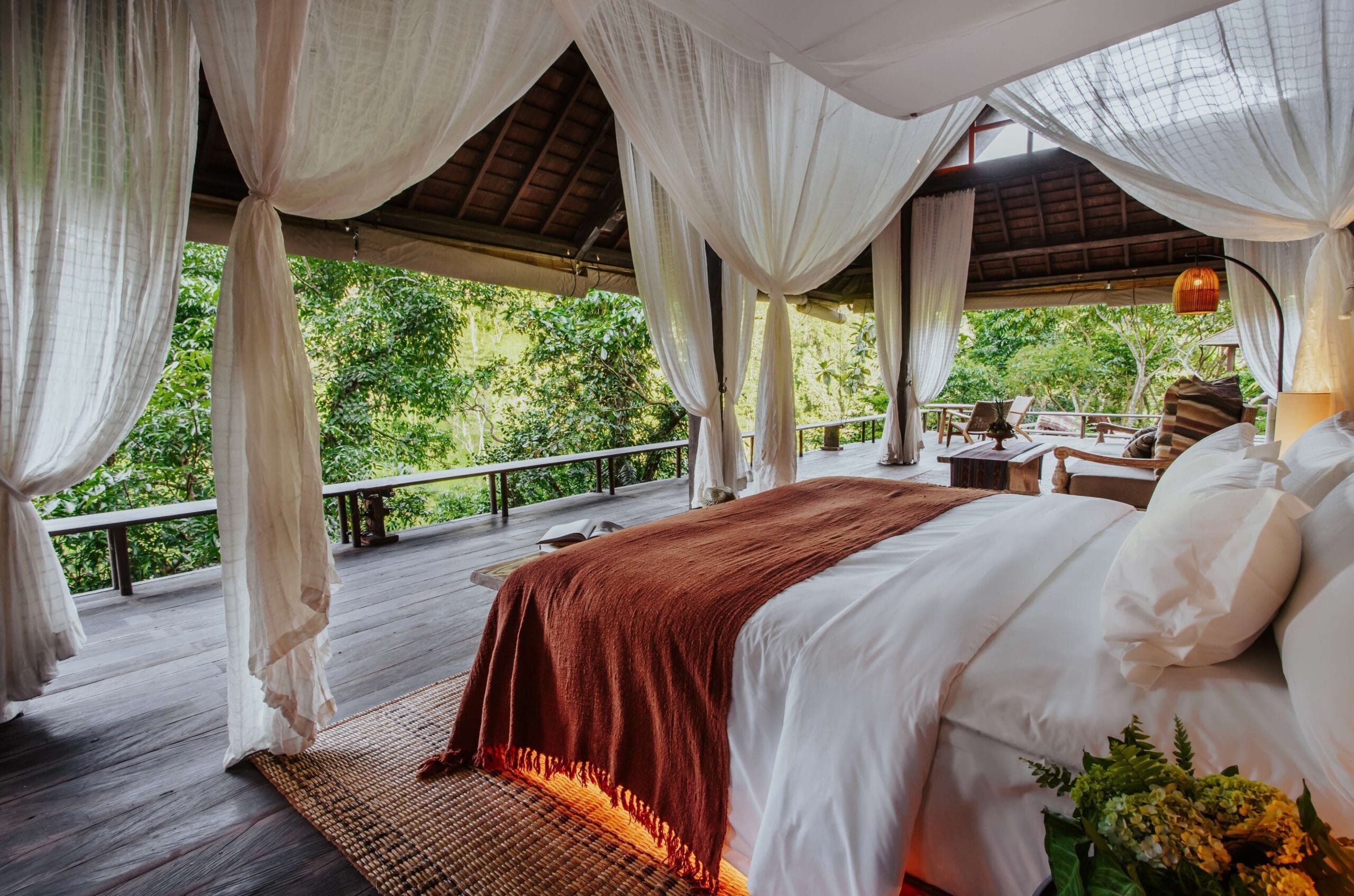 Buahan Banyan Tree Escape villa deck overlooking Bali's seven peaks and jungle valley