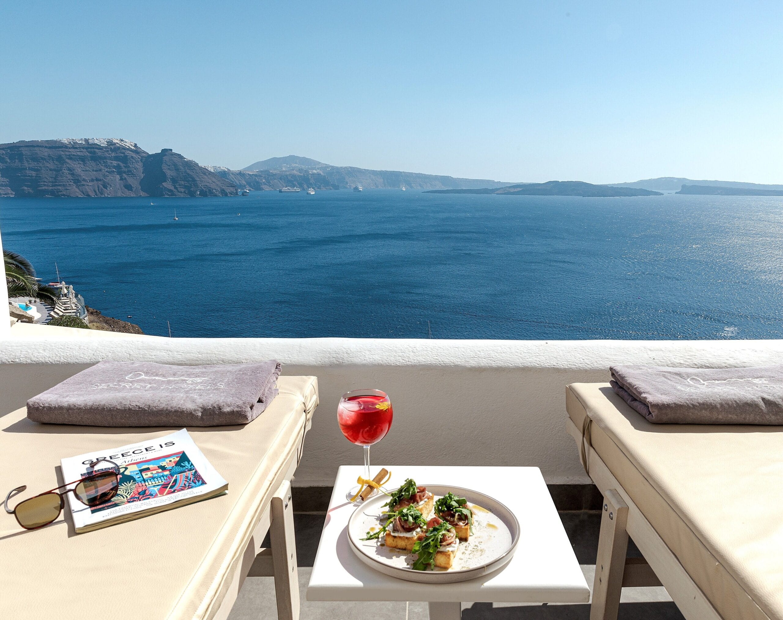Santorini Secret Suites & Spa cave suite interior in Oia with Cycladic design and caldera view