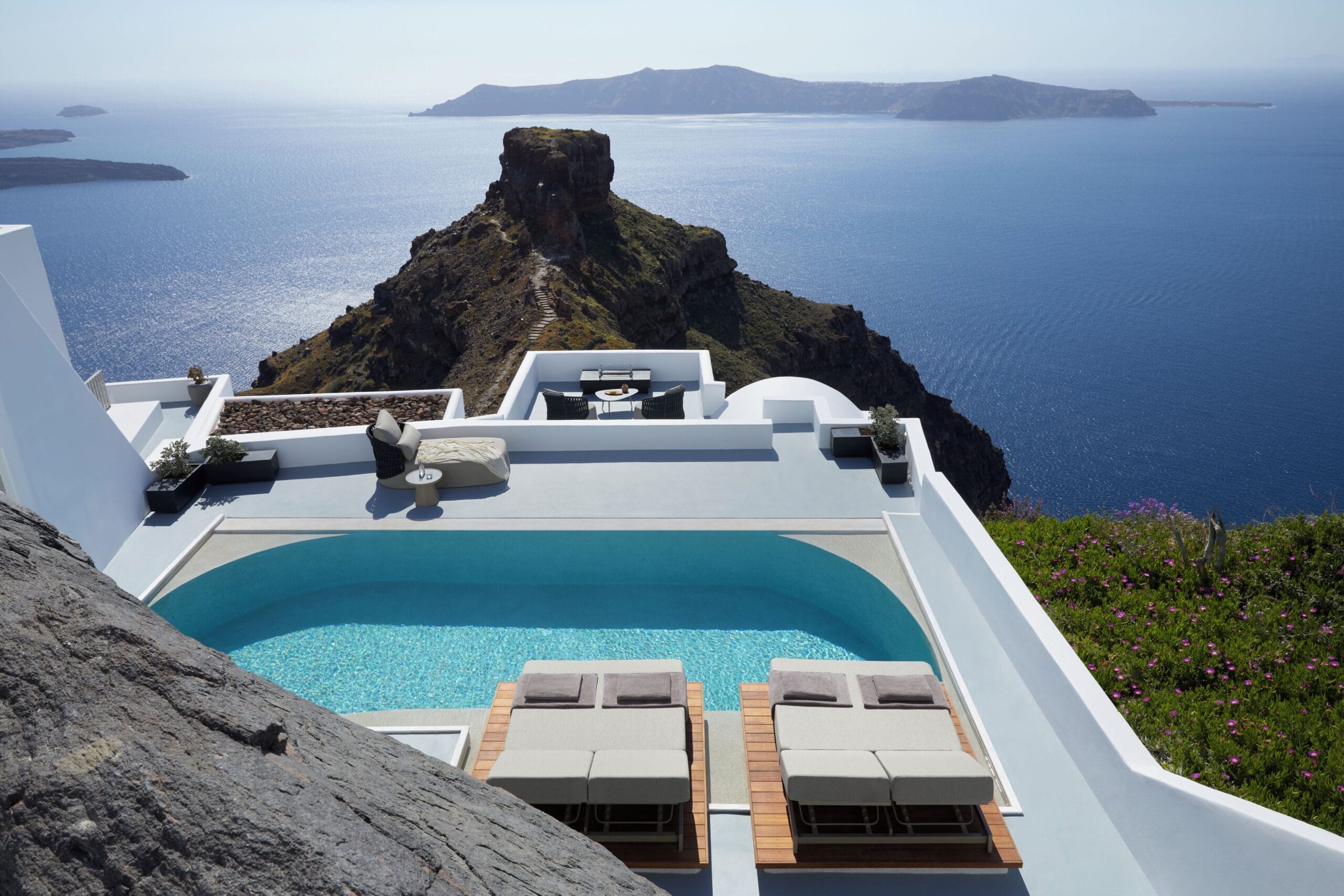 Grace Hotel Santorini cave-style suite with minimalist design and caldera view in Imerovigli