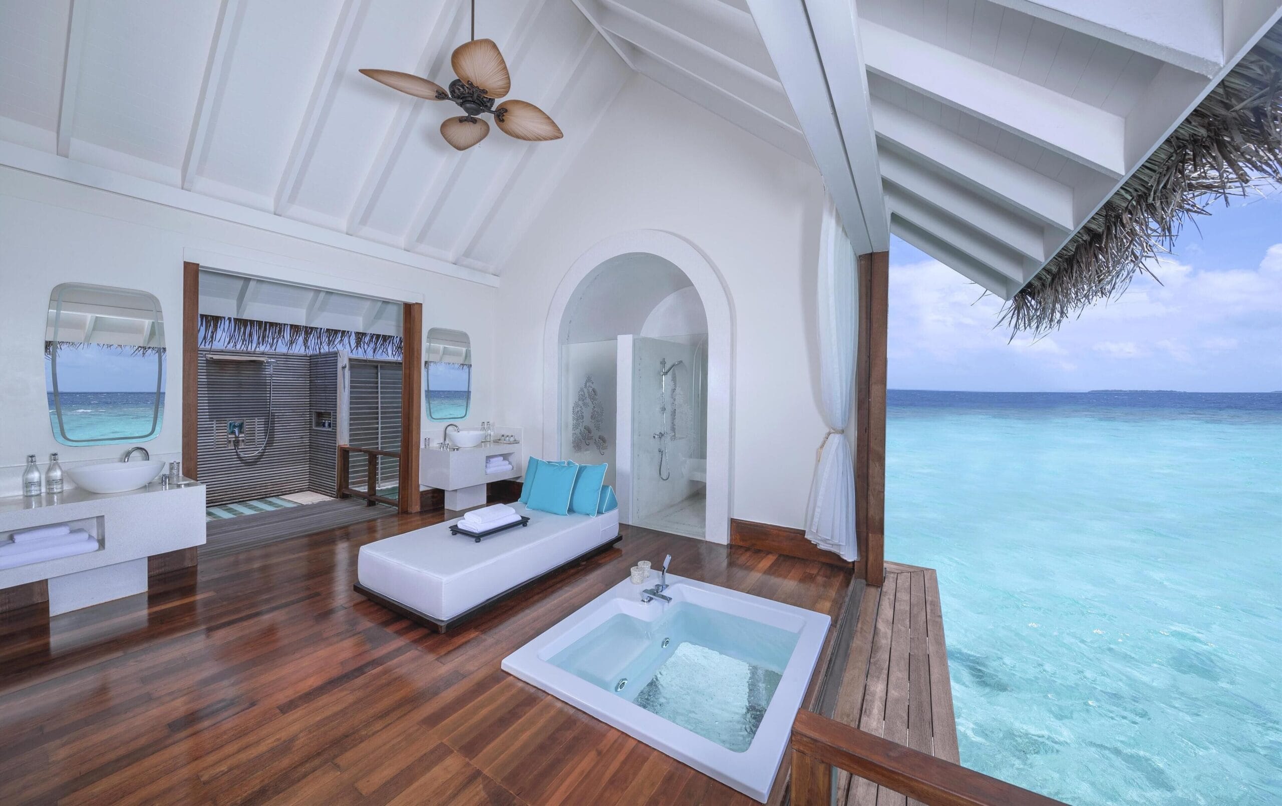 Anantara Kihavah Maldives water villa interior with floor-to-ceiling ocean views