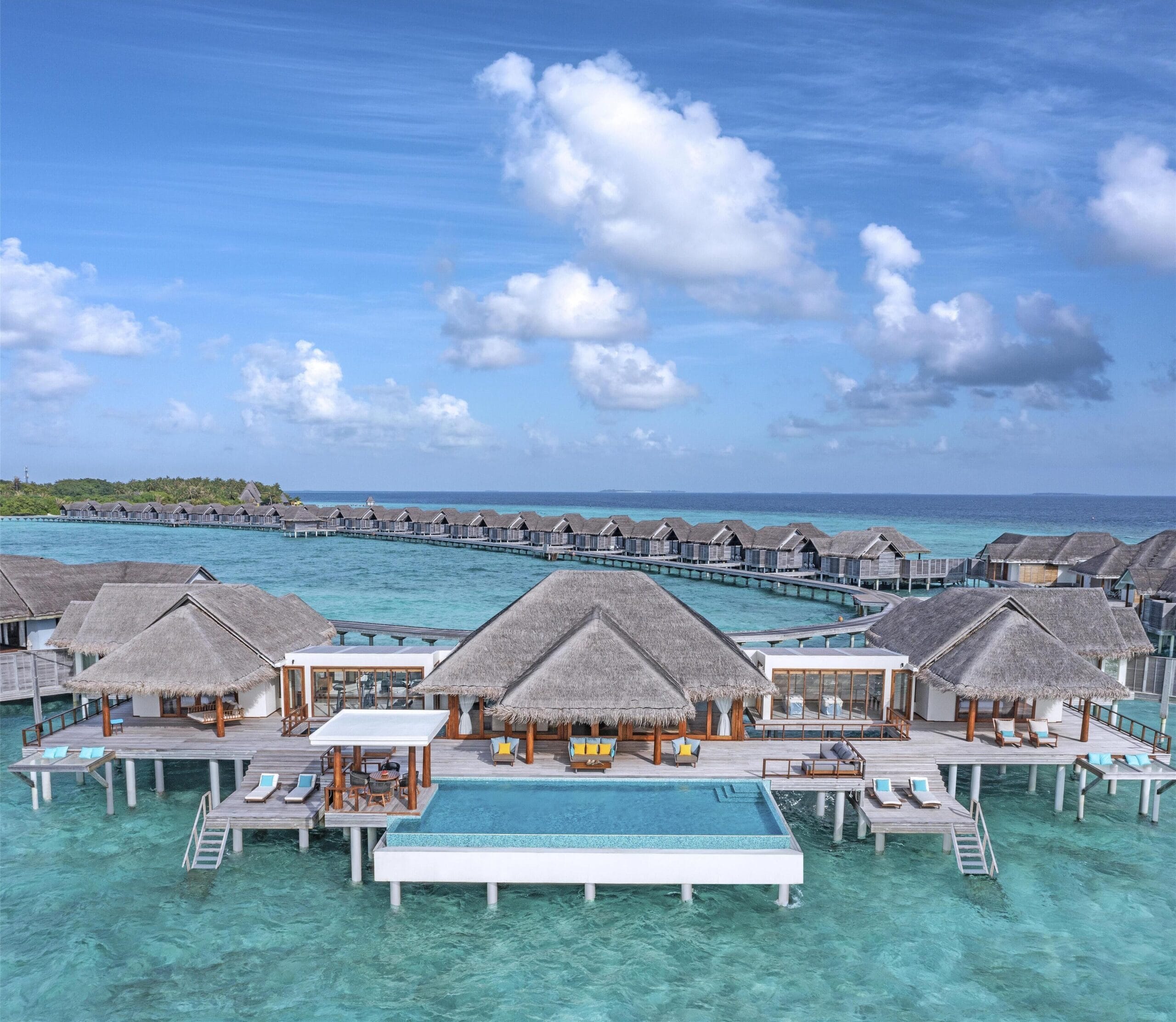 Overwater pool villa at Anantara Kihavah, a Maldives overwater bungalow above the Baa Atoll house reef