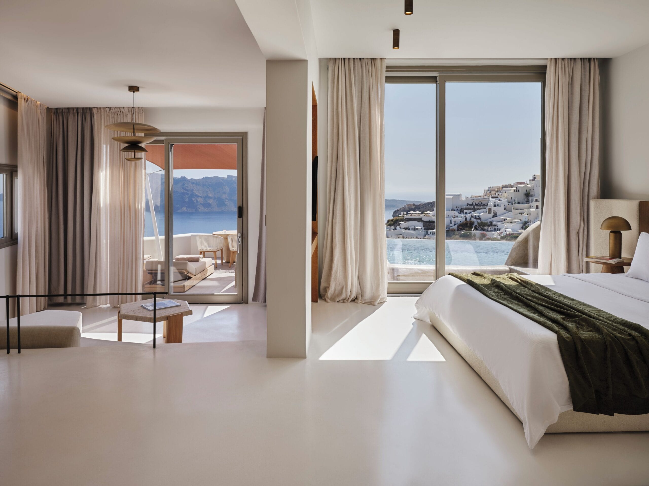 Andronis Luxury Suites suite opening onto a private pool with caldera view