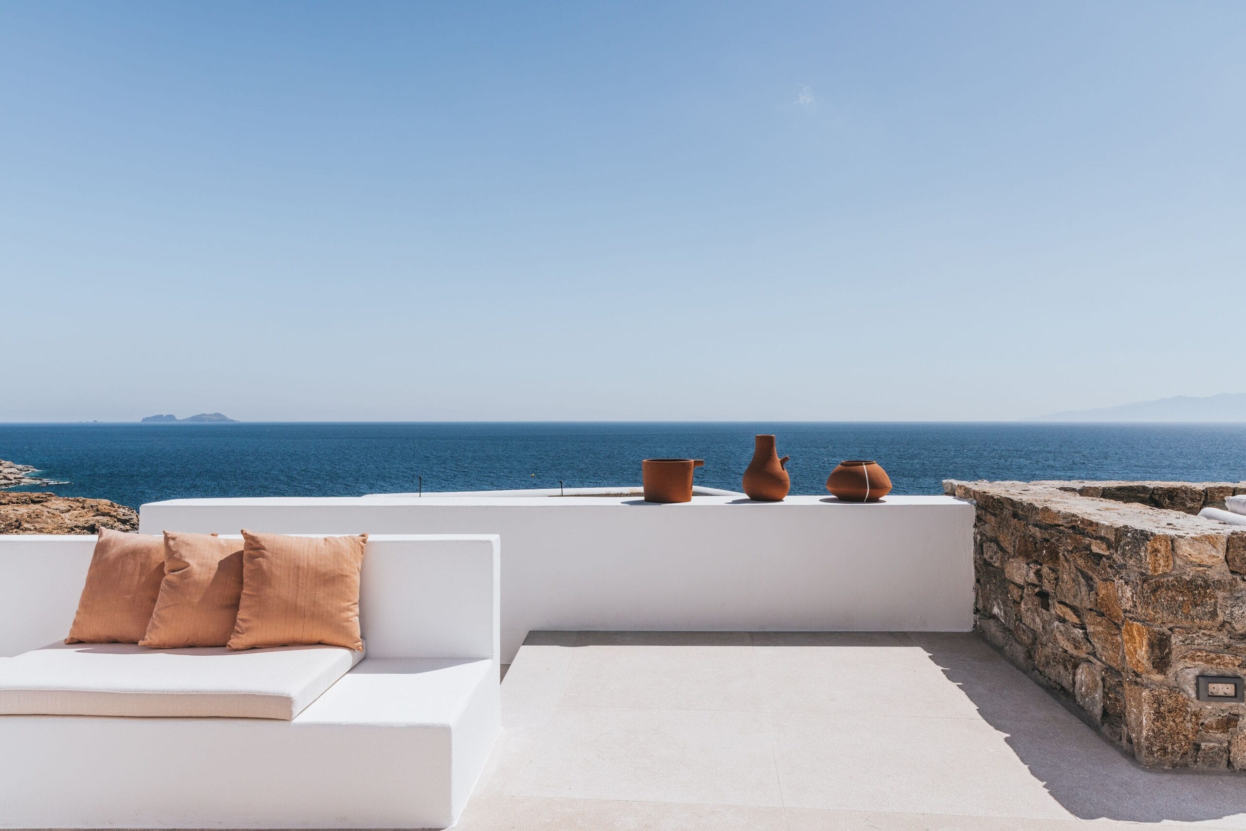 Luxury sea view terrace overlooking a private cove at Cali Mykonos