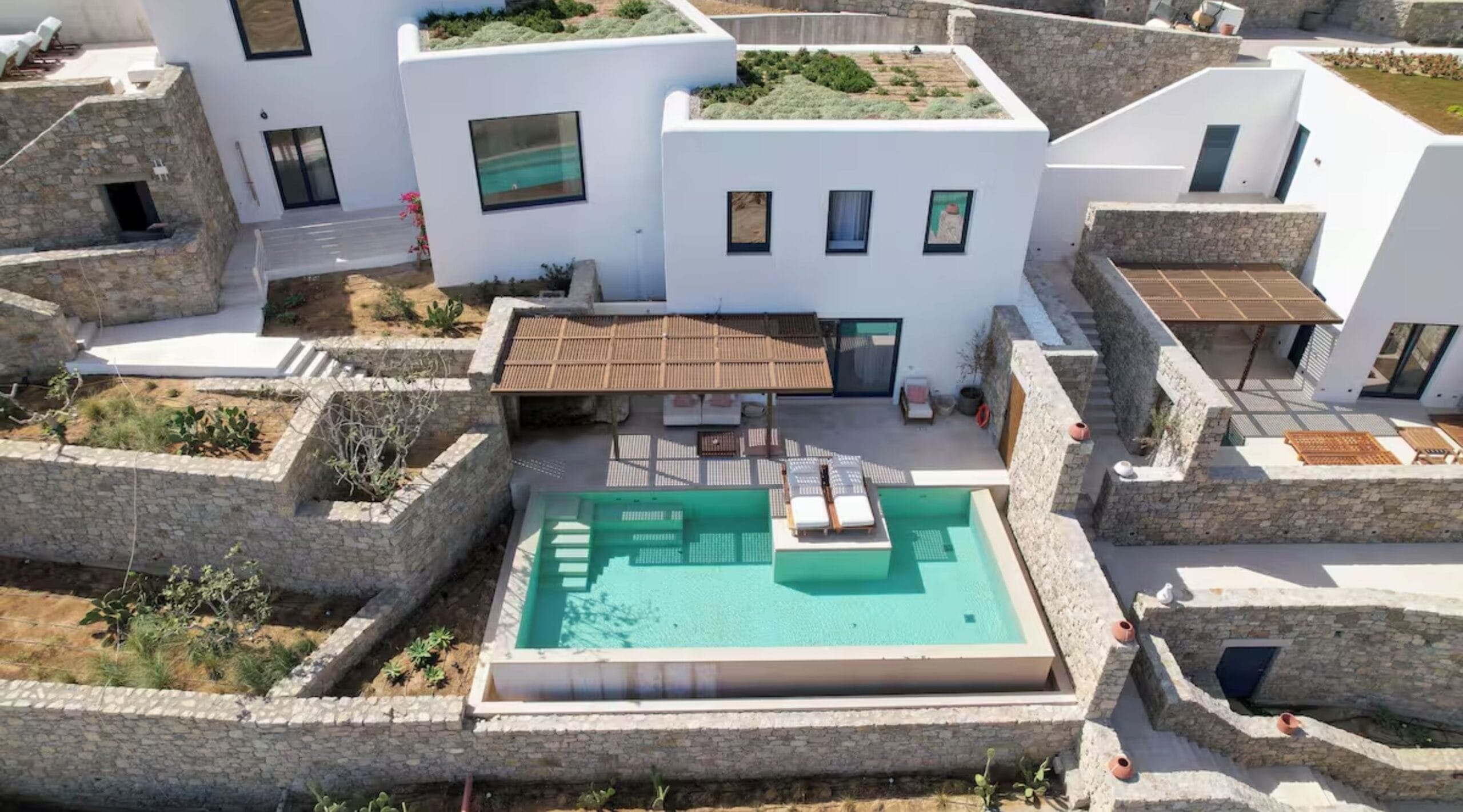 Private pool villa exterior on the Kalafatis hillside at Cali Mykonos