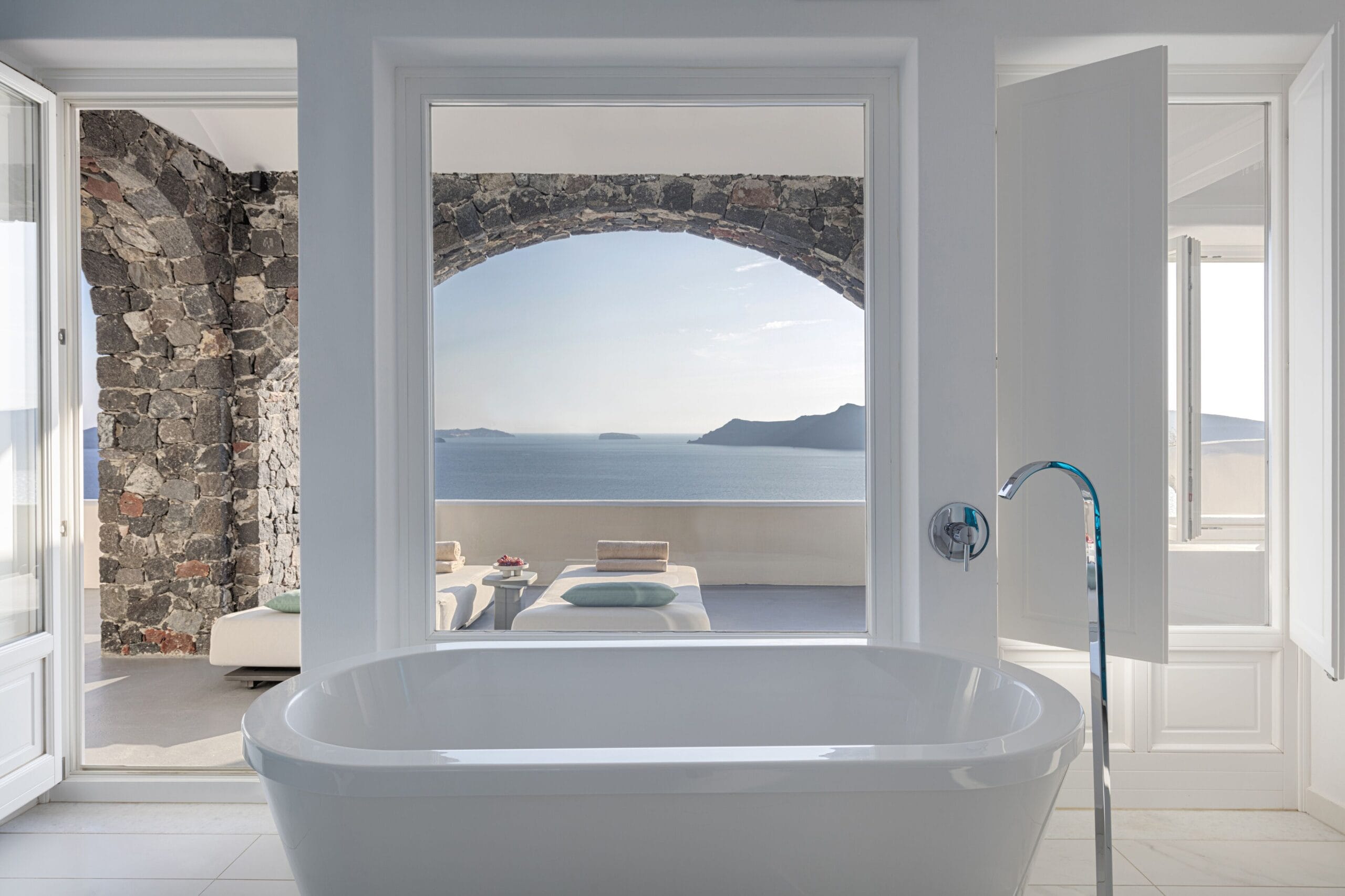 Luxury suite bathroom with Aegean sea view at Canaves Oia Suites