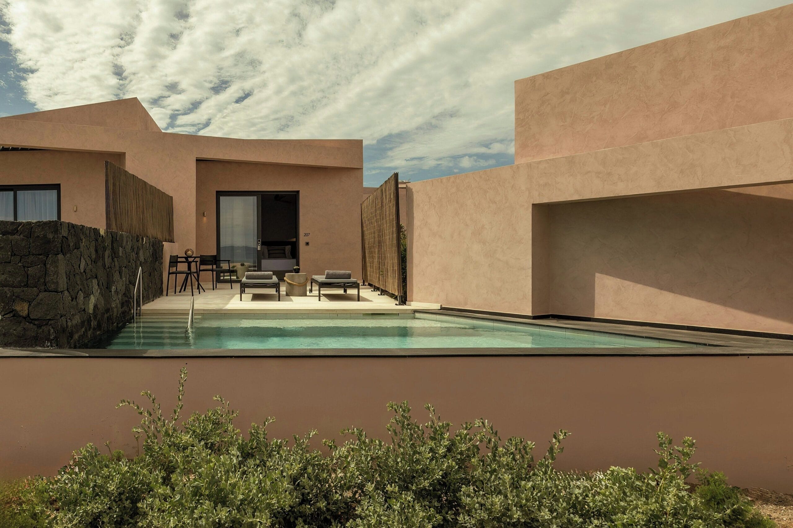 Domes Novos Santorini private pool villa with terrace and sunbeds
