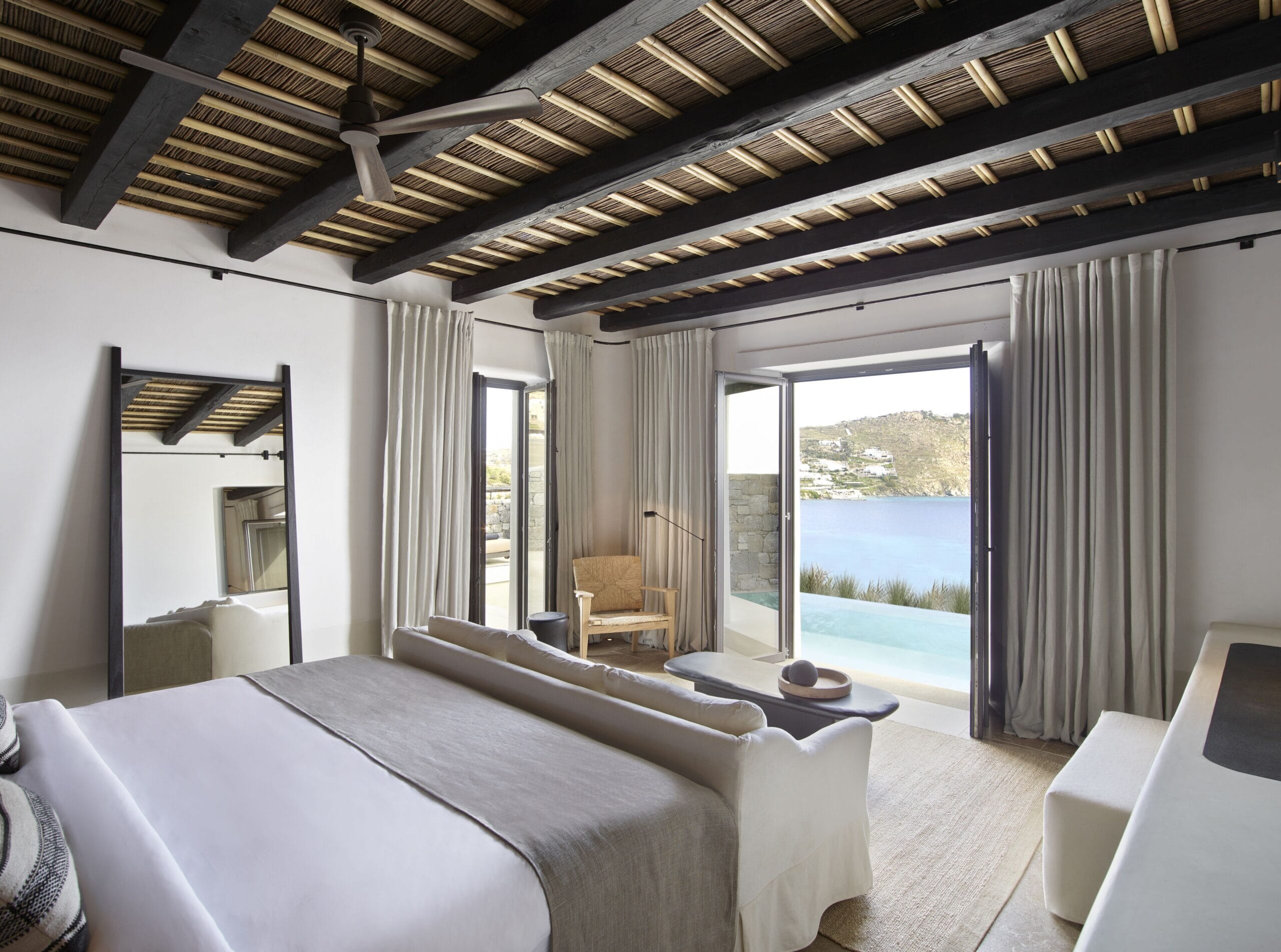 Luxury suite opening onto its private pool and Aegean view at Kalesma Mykonos