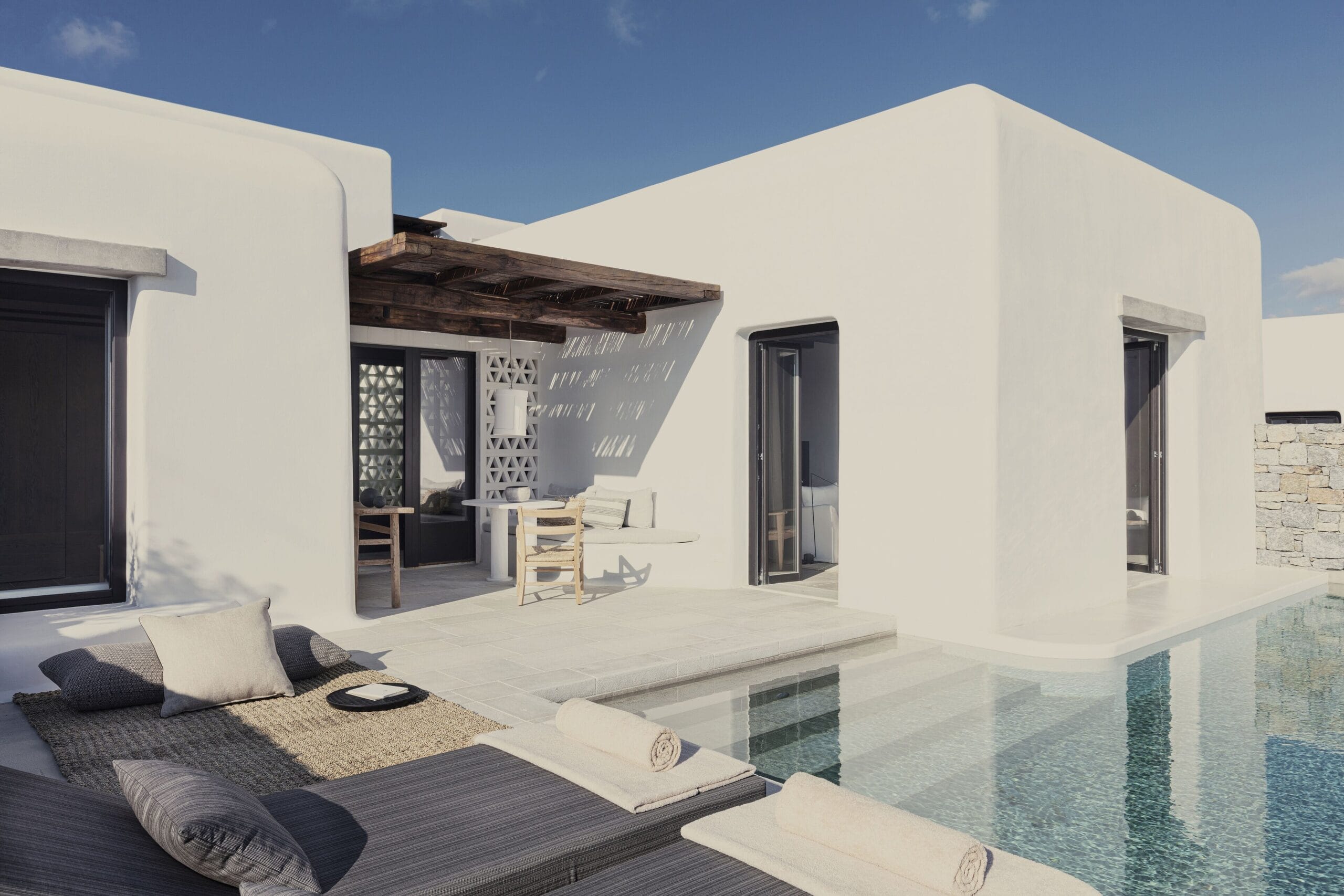 Whitewashed villa with its own private infinity pool above Ornos Bay at Kalesma Mykonos