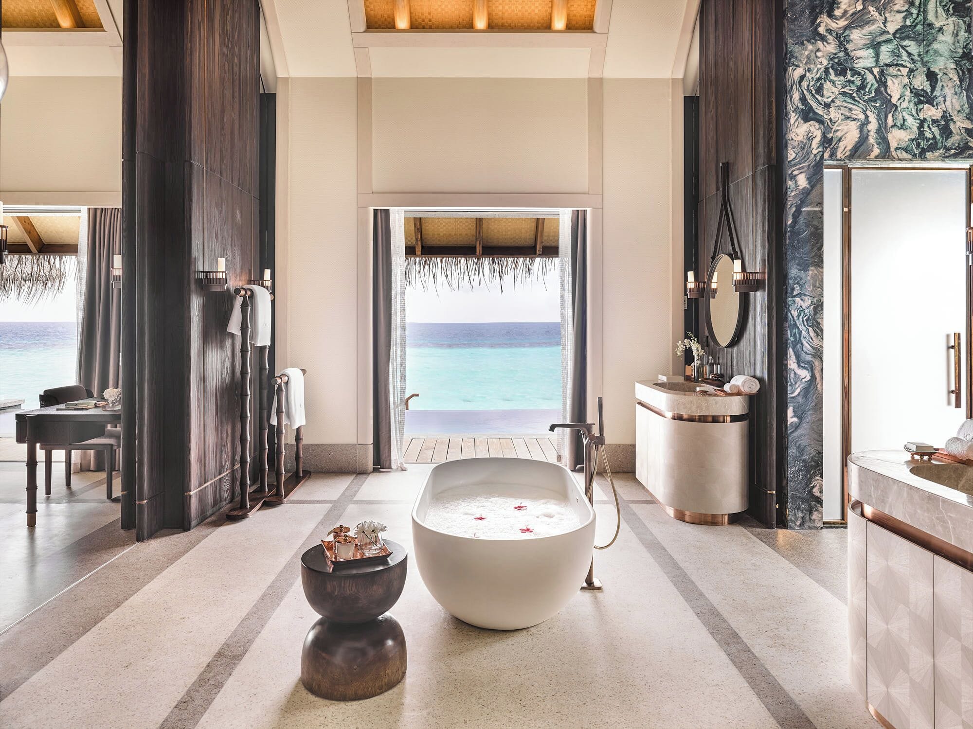 Luxury overwater villa bathroom with lagoon views at JOALI Maldives