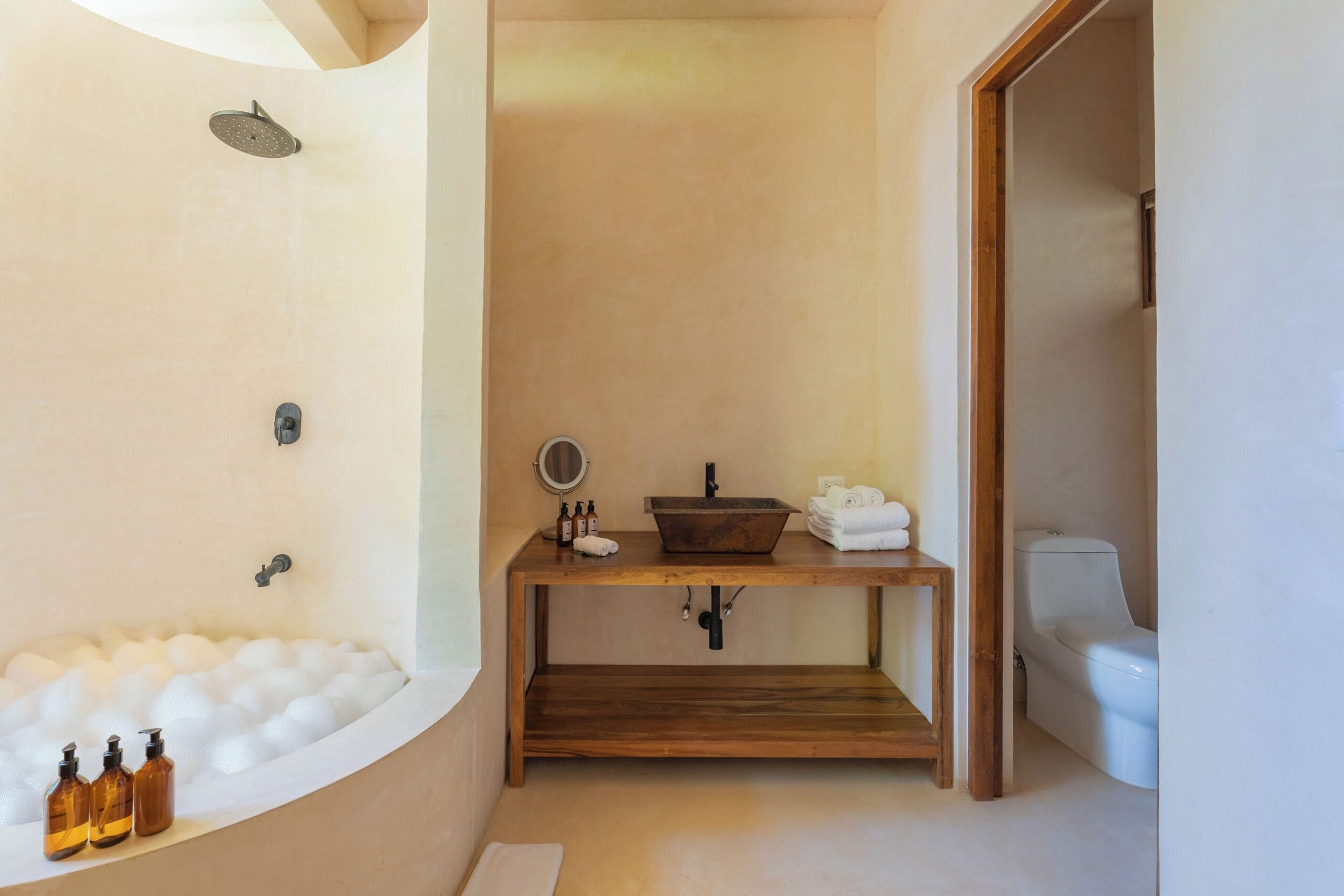 Luxury indoor-outdoor bathroom at La Valise Tulum