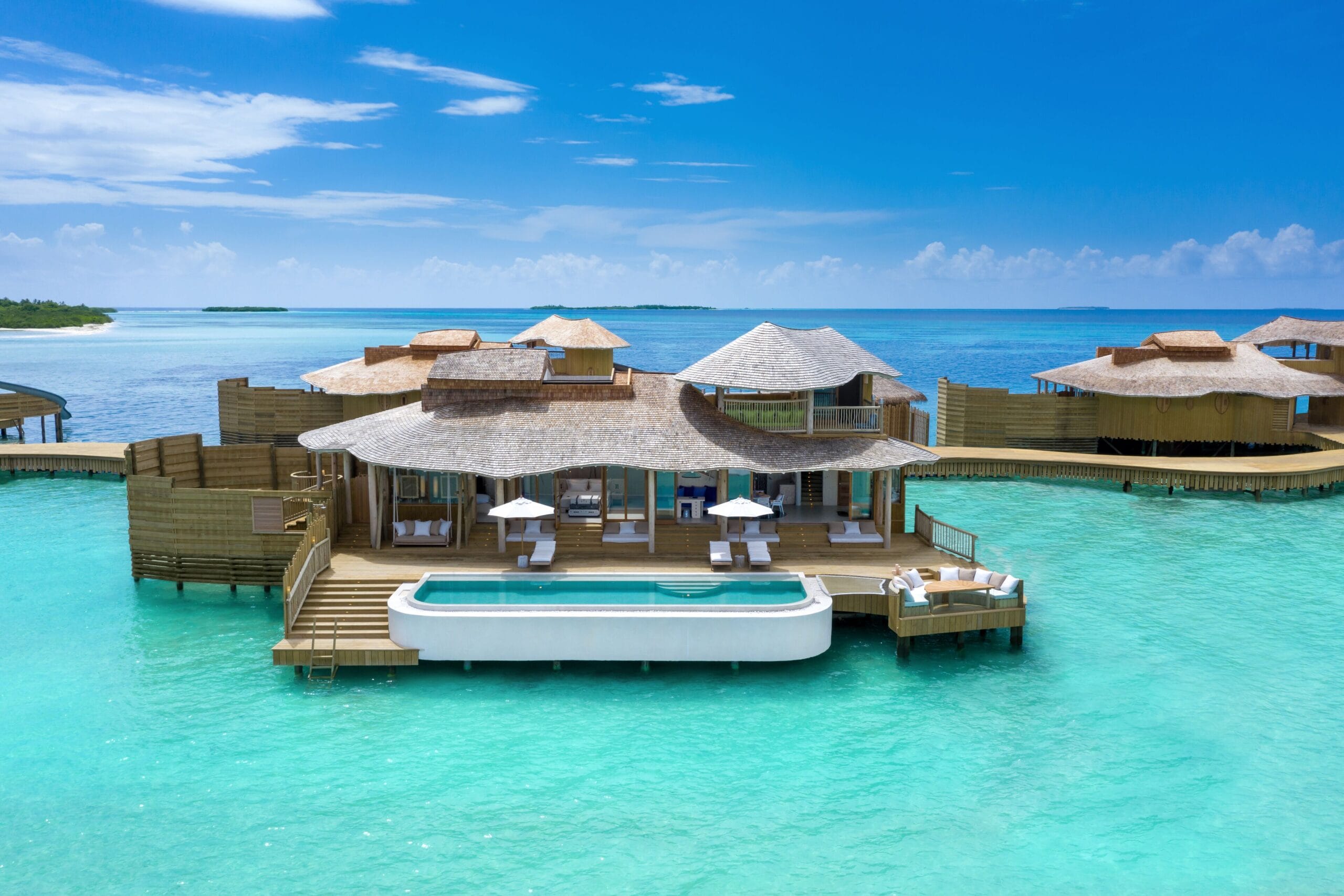 Overwater pool villa with a private pool and water slide at Soneva Jani, Maldives