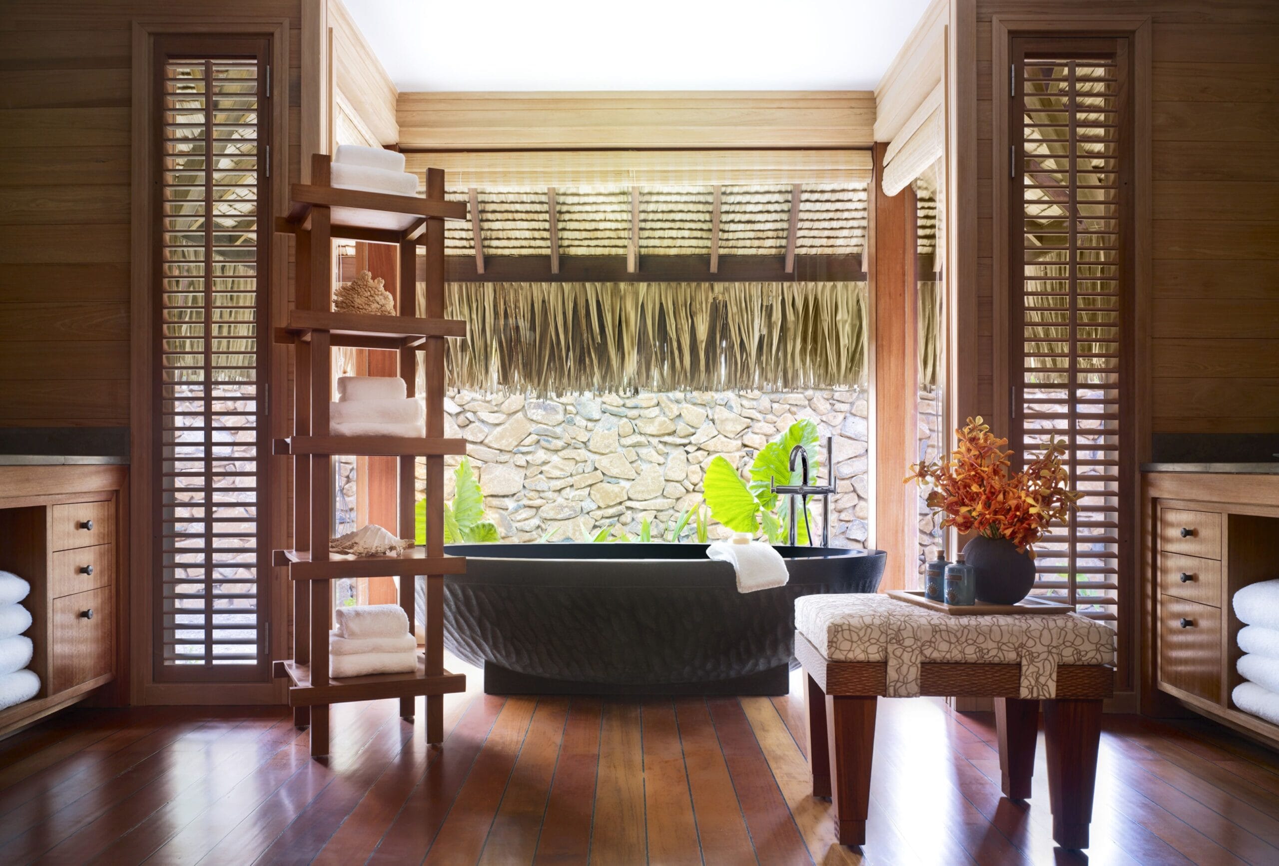 Luxury overwater villa bathroom with lagoon views at Four Seasons Resort Bora Bora