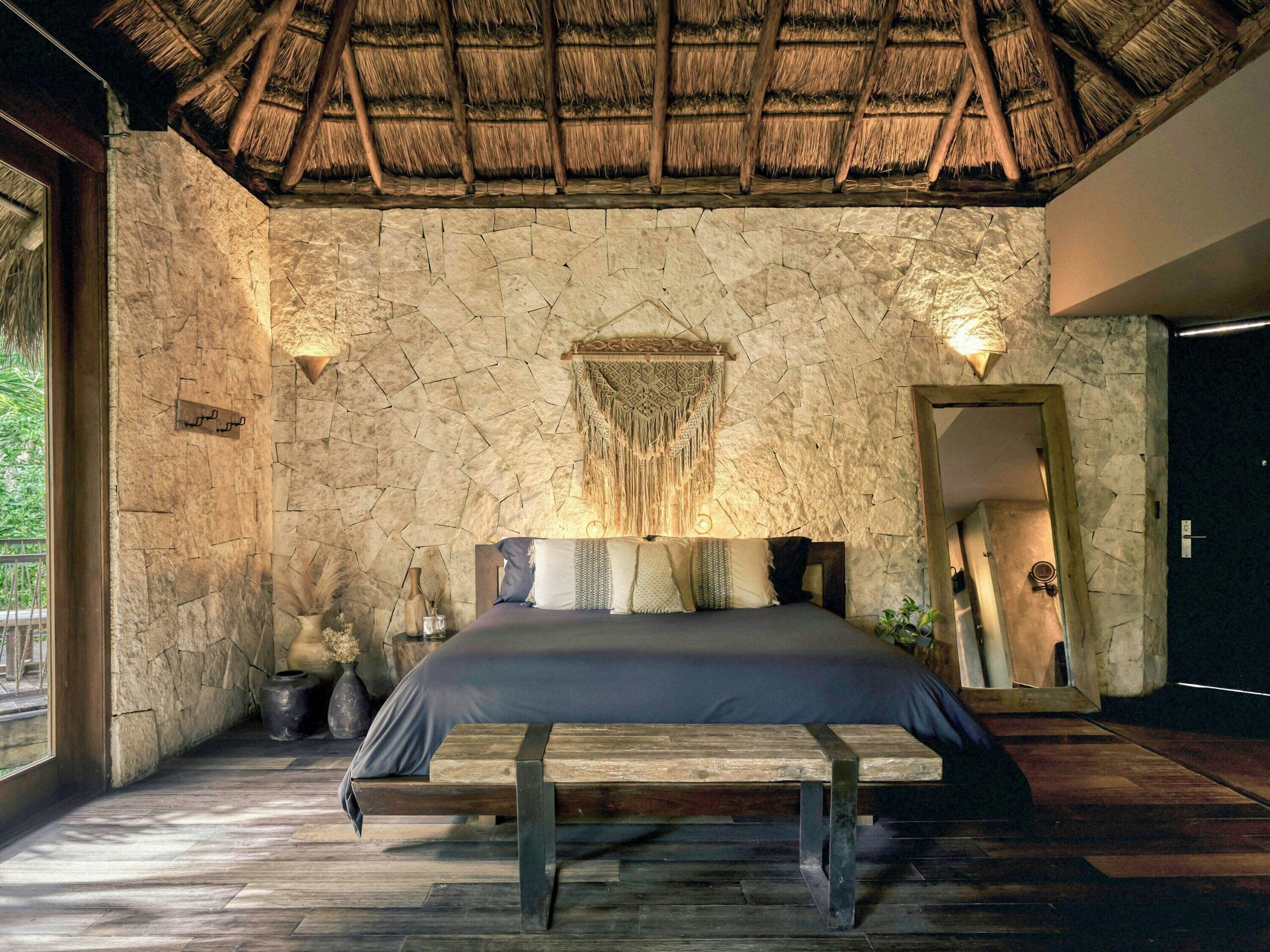 Luxury suite bedroom in earthy tones at Be Tulum