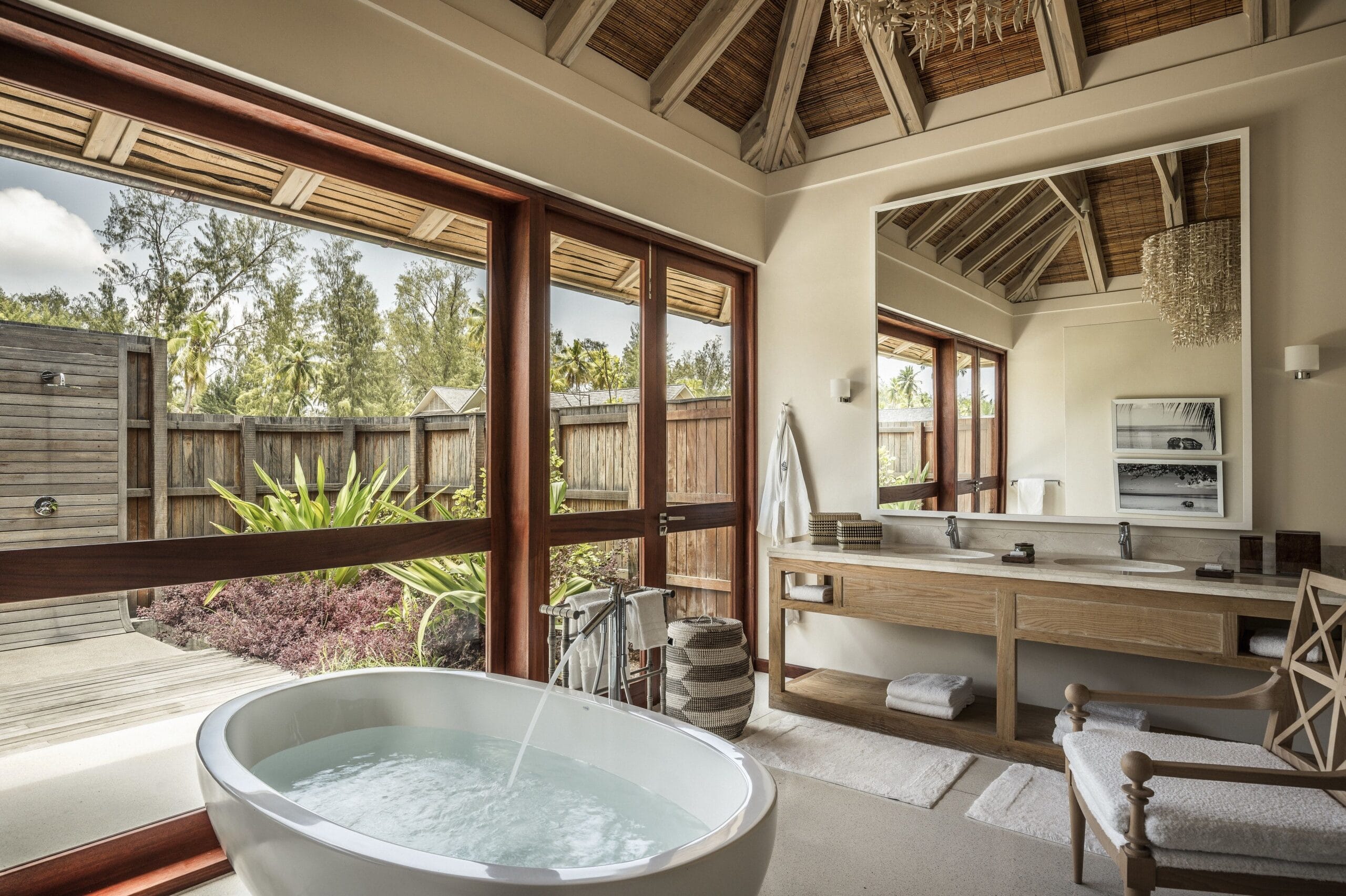 Open-air luxury villa bathroom at Four Seasons Seychelles at Desroches Island