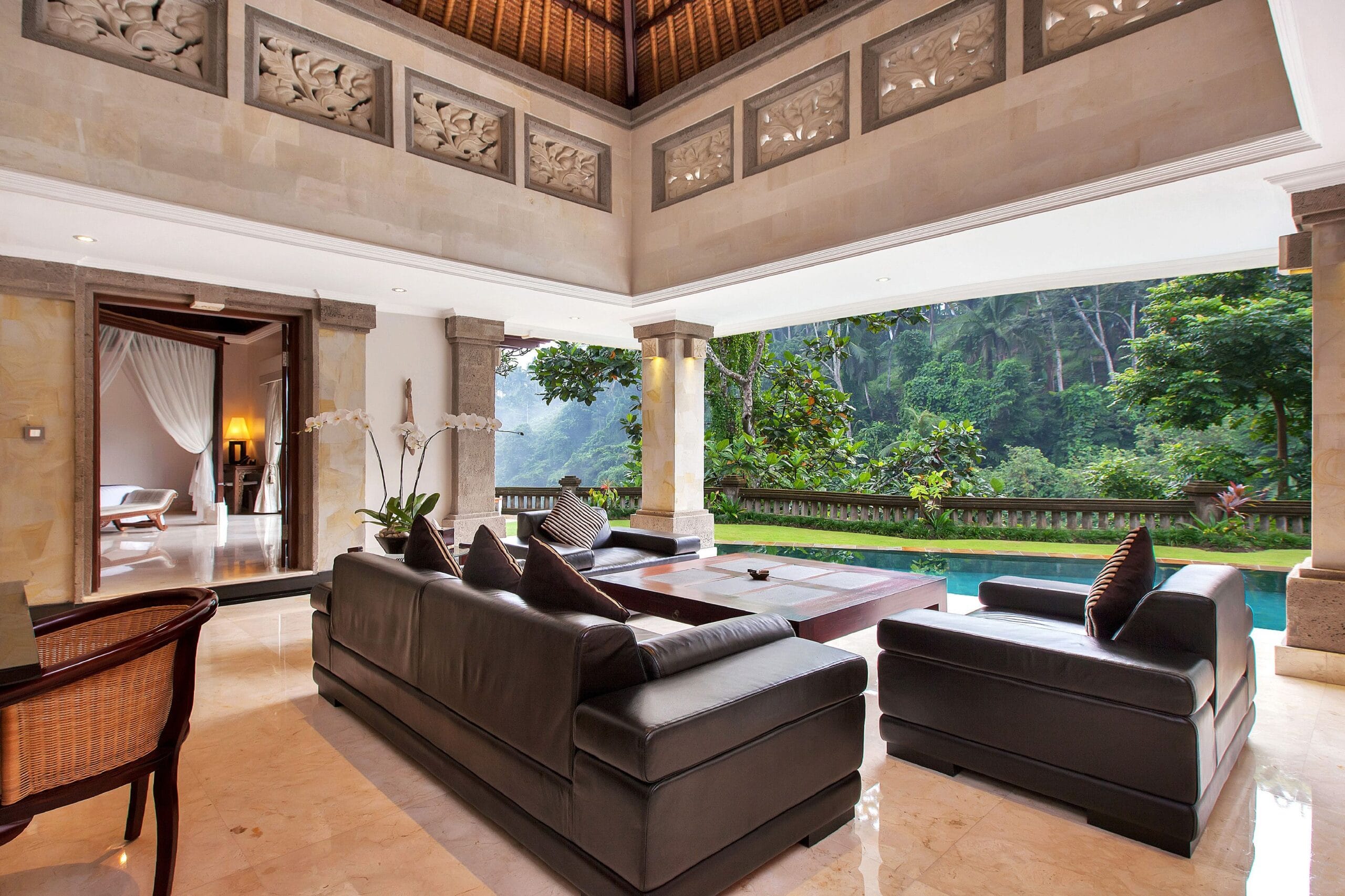 Luxury villa living room open to the jungle at Viceroy Bali