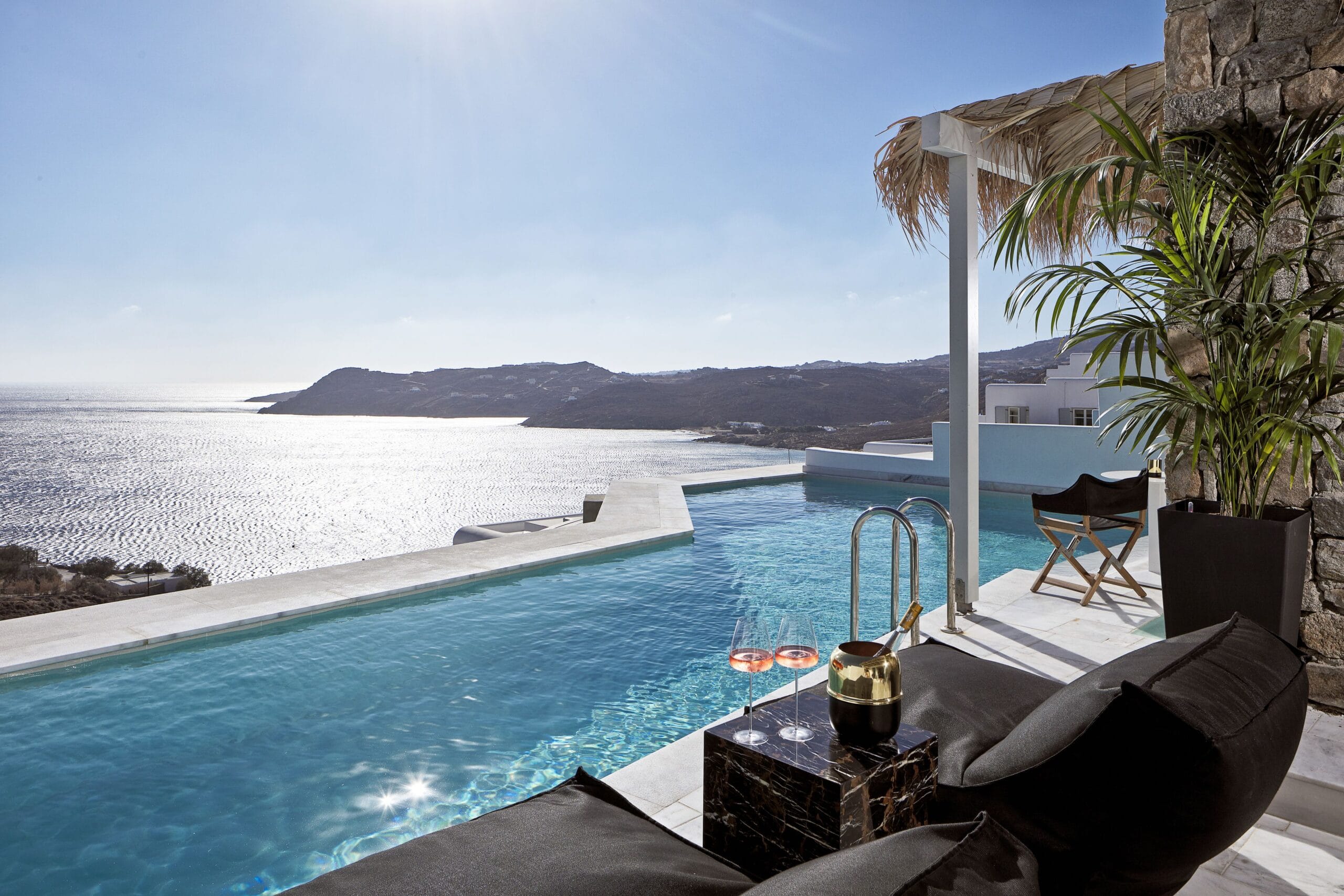Private infinity pool on a villa terrace overlooking the Aegean at Myconian Villa Collection in Mykonos, Greece