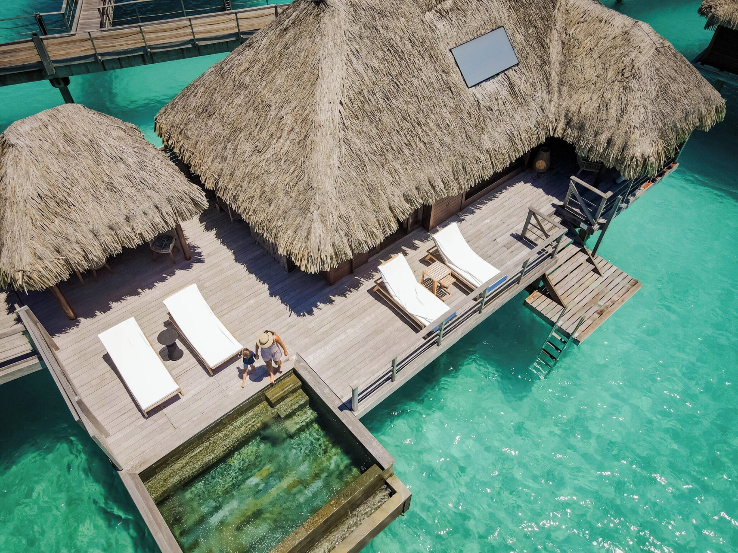 Overwater bungalow with a plunge pool above the turquoise lagoon and Mount Otemanu at Four Seasons Resort Bora Bora