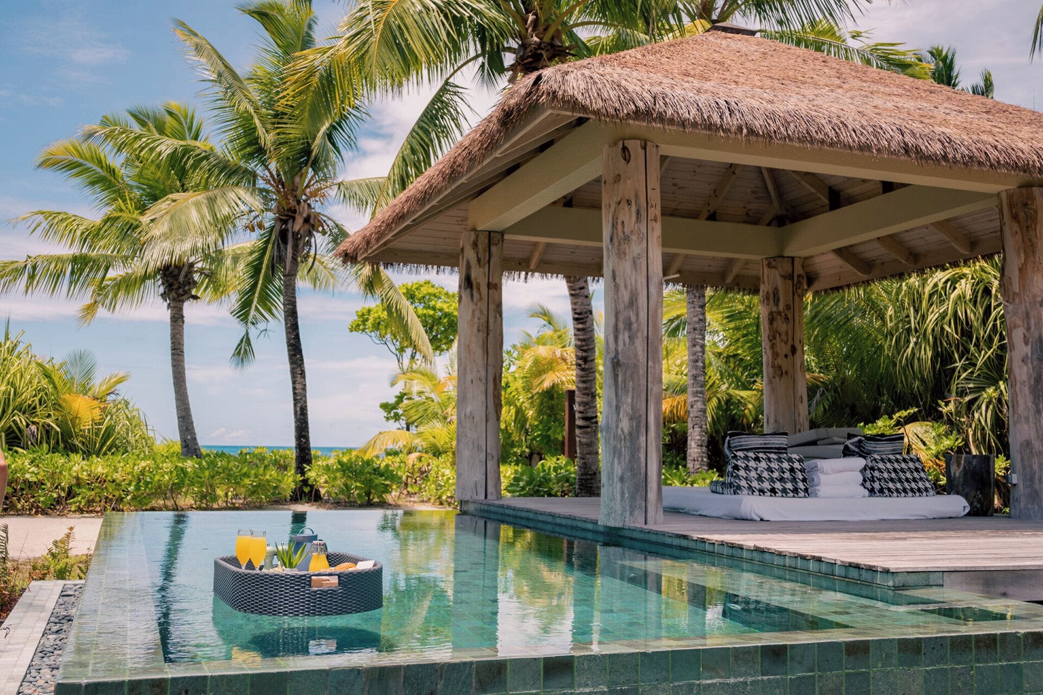 Private infinity pool on a villa terrace at Four Seasons Seychelles at Desroches Island