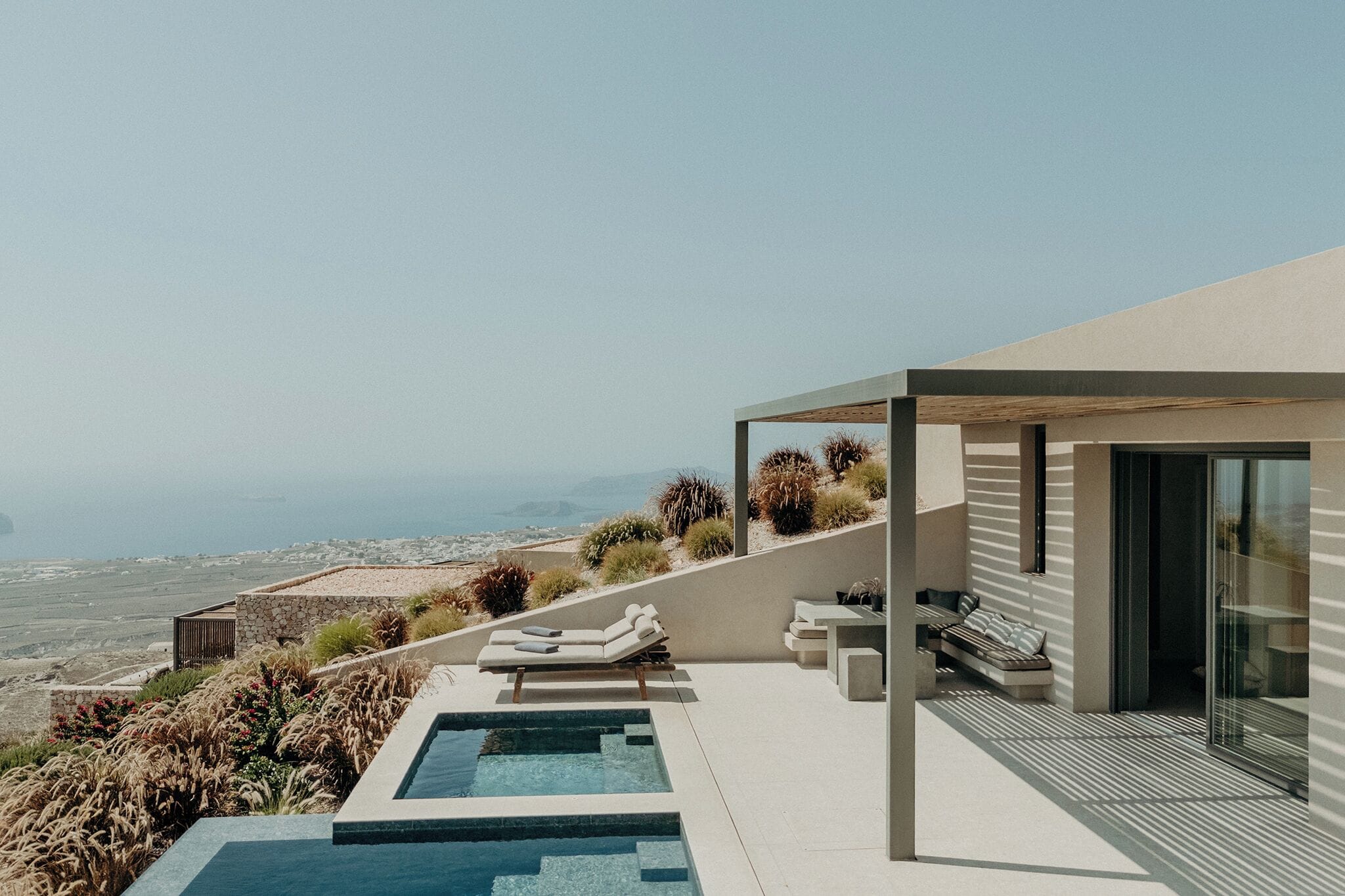 Private pool and lounge terrace at a Santorini Sky luxury villa in Pyrgos