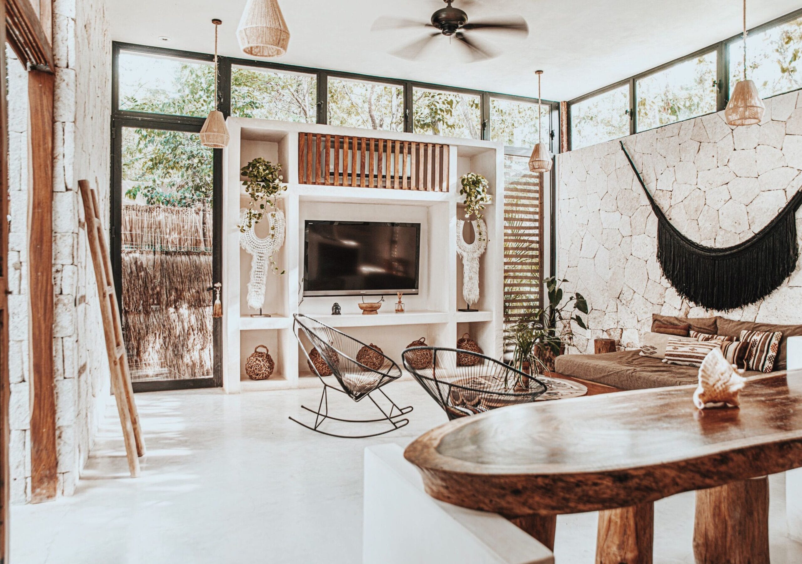 Double-height jungle-design living room at a Una Vida villa in Tulum