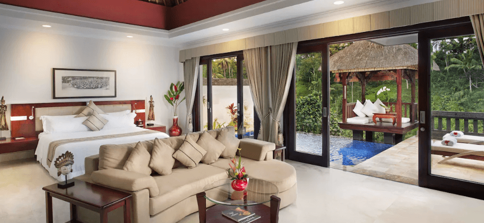 Private pool villa bedroom opening to a valley view at Viceroy Bali