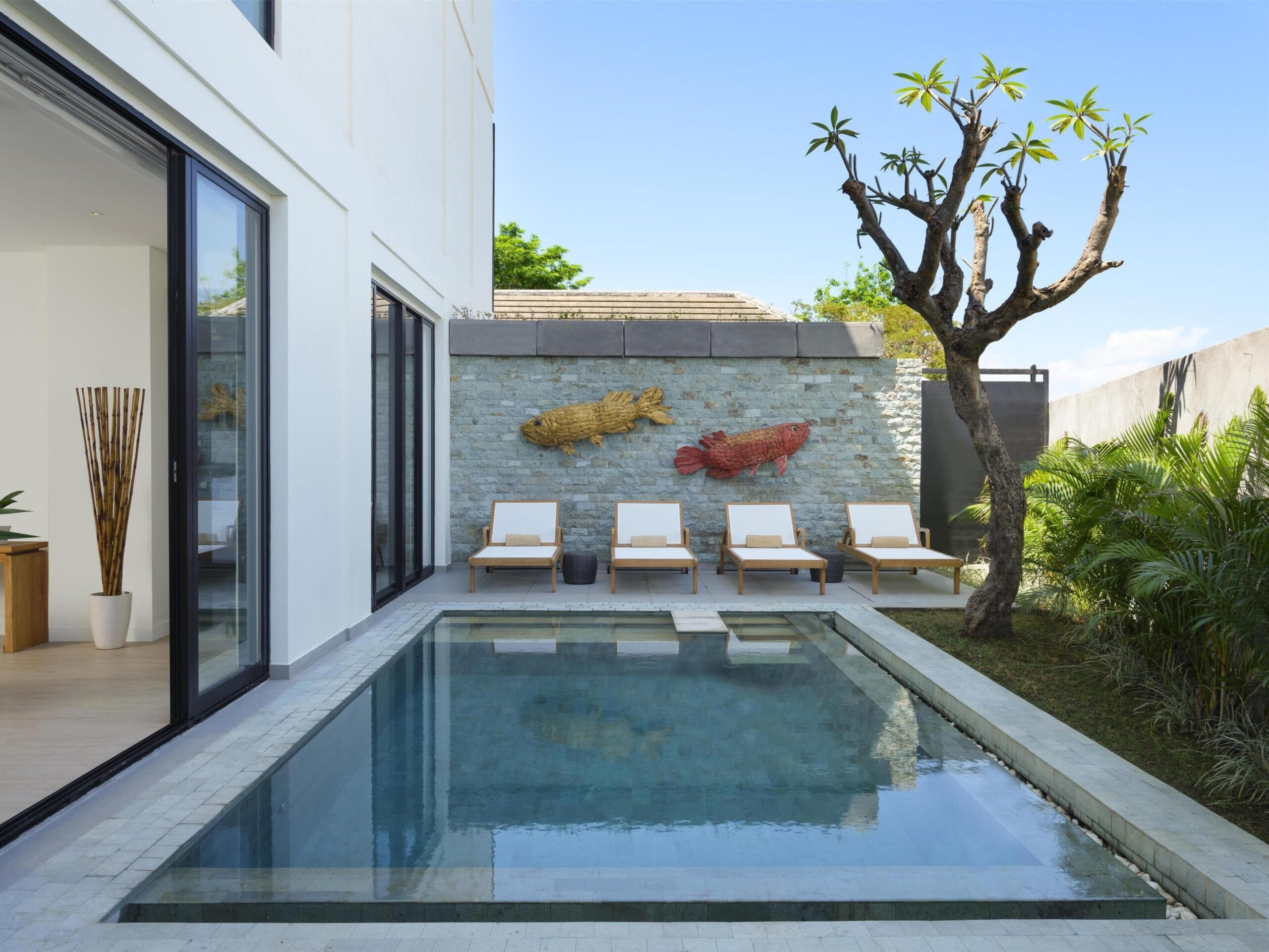 Private pool and sundeck outside a pool villa at Avani Seminyak Bali Resort