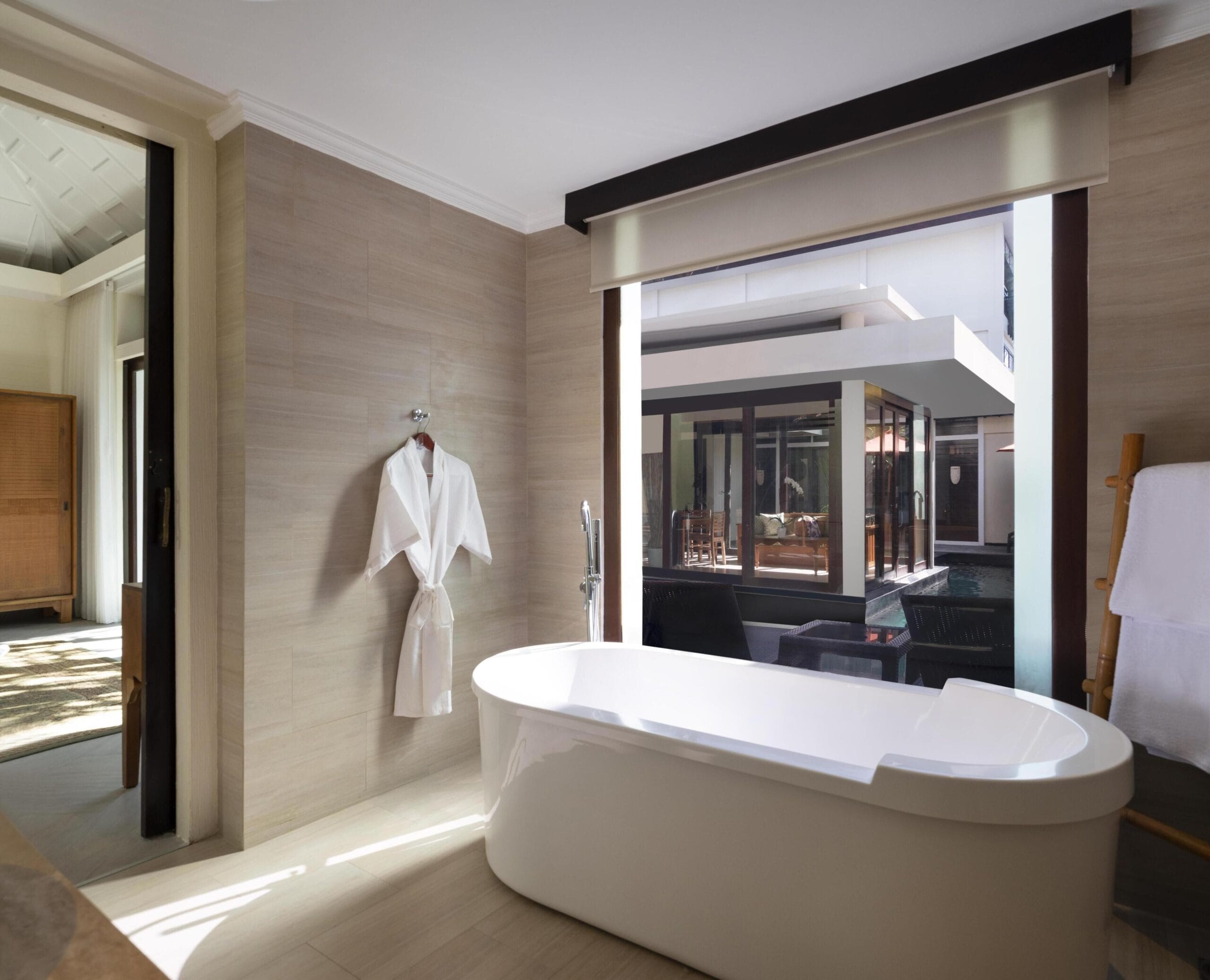 Villa bathroom with sunken bathtub and monsoon shower at Avani Seminyak Bali Resort