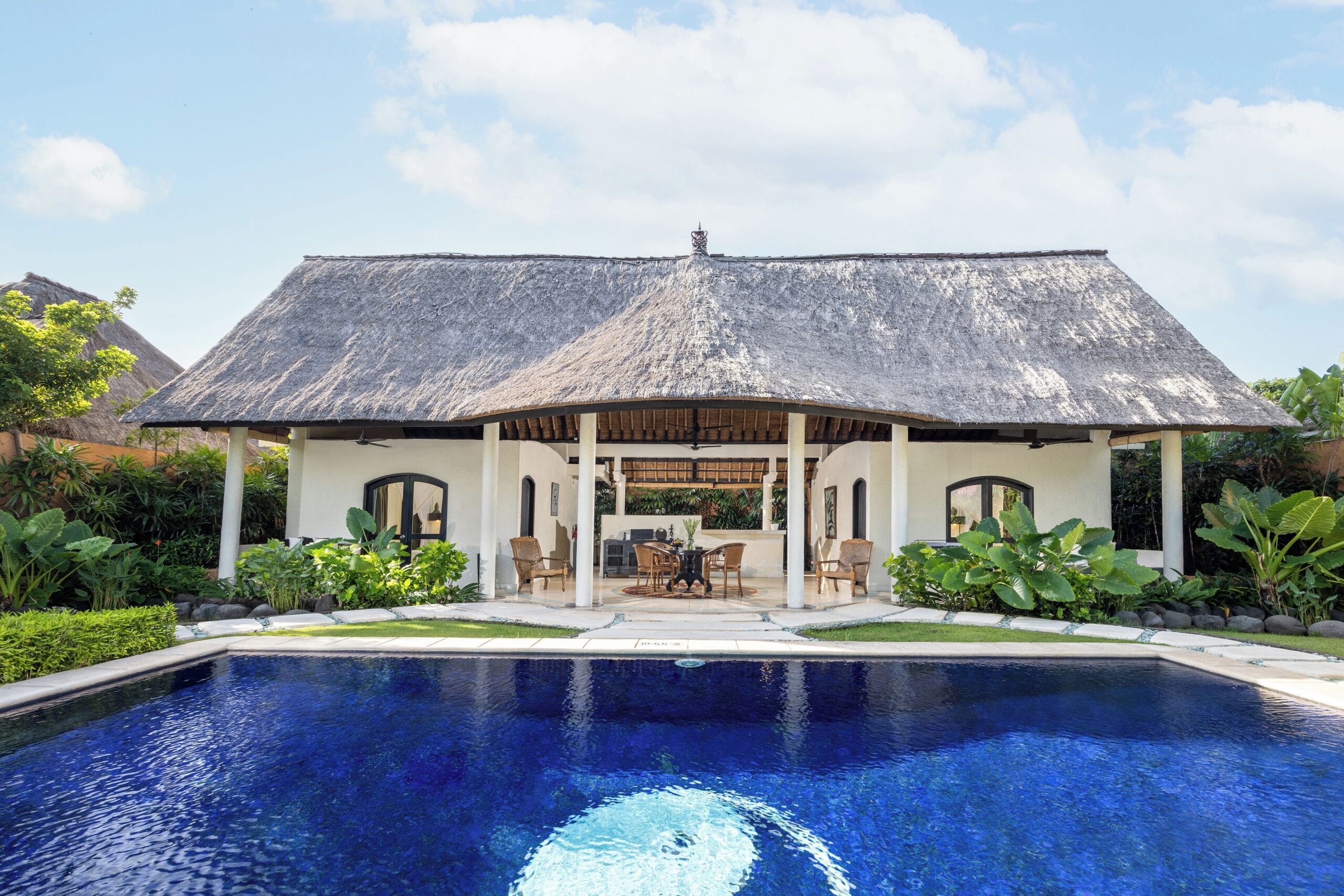 Private pool and tropical garden in a villa at Impiana Private Villas Seminyak, Bali