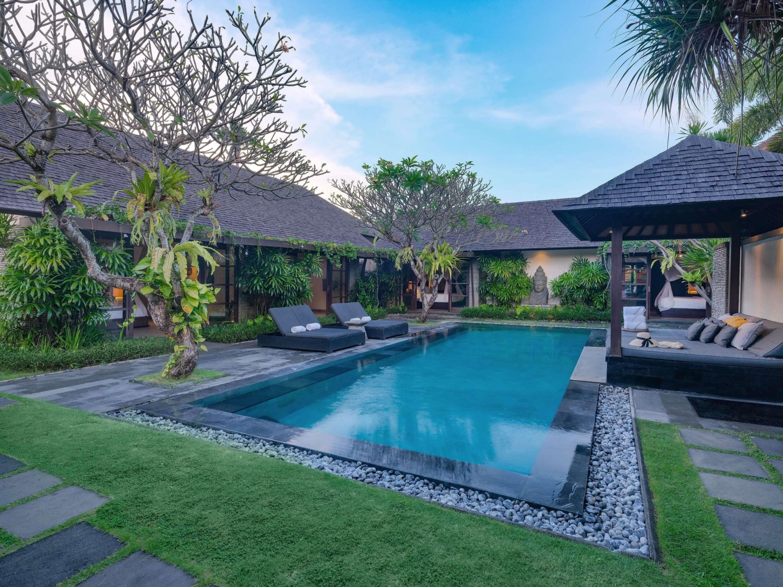 Private pool and teak sun deck in a walled villa garden at Peppers Seminyak, Bali