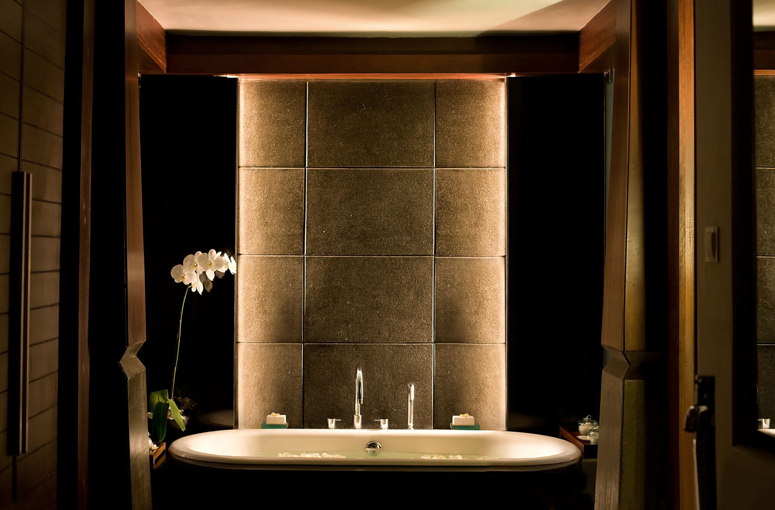 Villa bathroom with deep soaking bath at The Kayana Seminyak, Bali