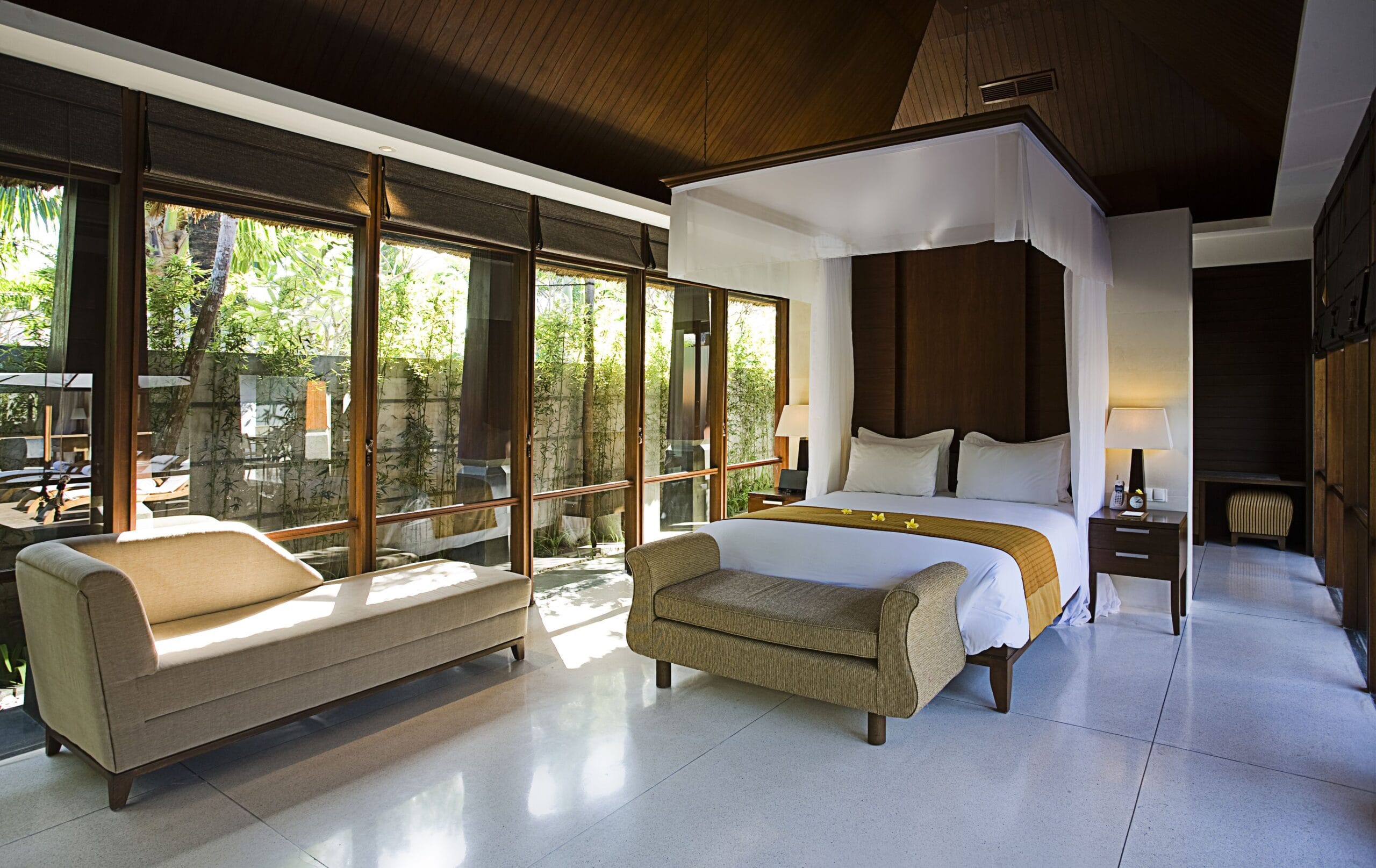 Canopy king bed in a villa bedroom at The Kayana Seminyak, Bali