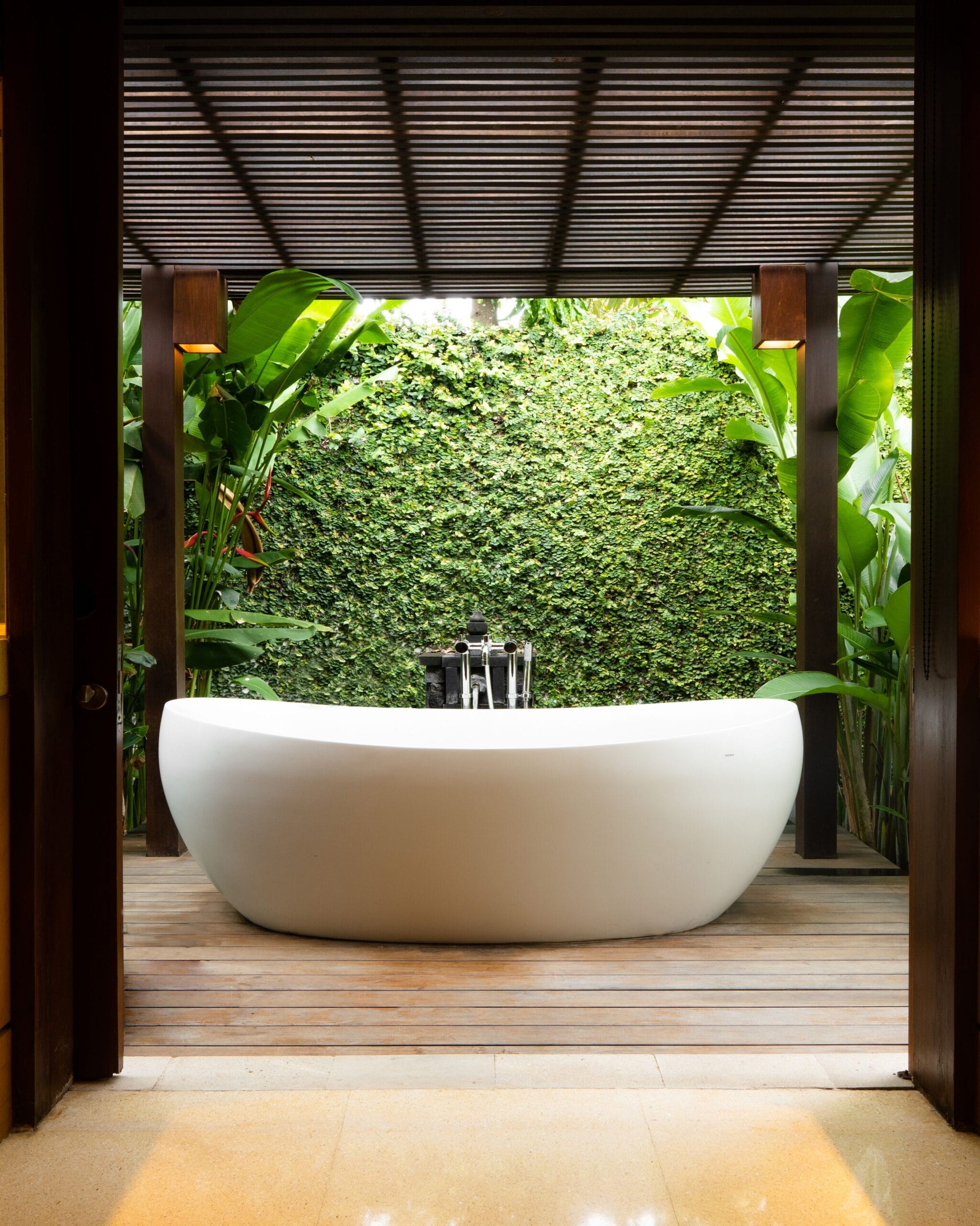 Outdoor bathtub in a villa garden at The Legian Seminyak, Bali