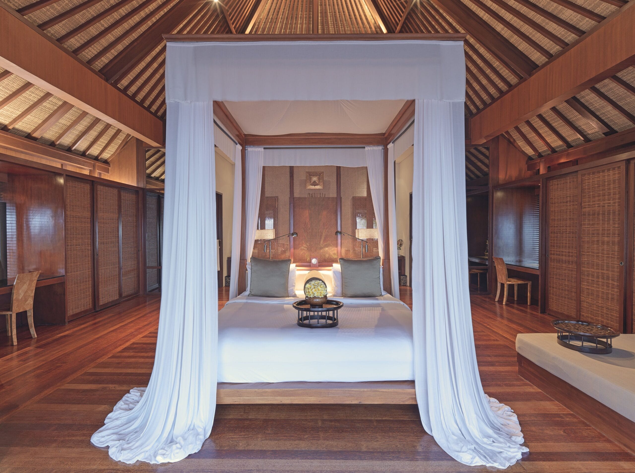 Canopied four-poster bed in a villa bedroom at The Legian Seminyak, Bali
