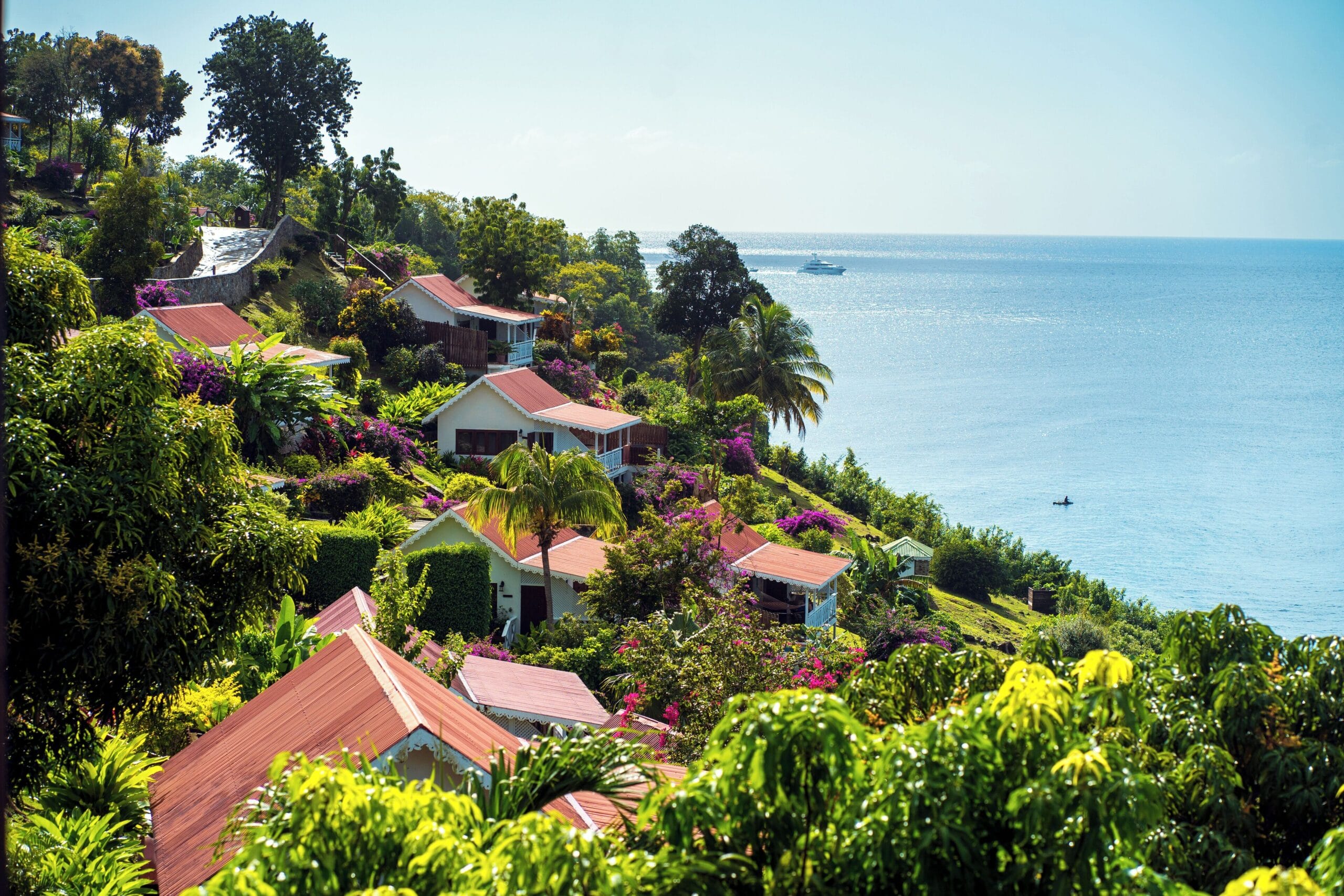 Gingerbread cottages on the hillside above Anse Cochon cove at Ti Kaye Resort, St. Lucia